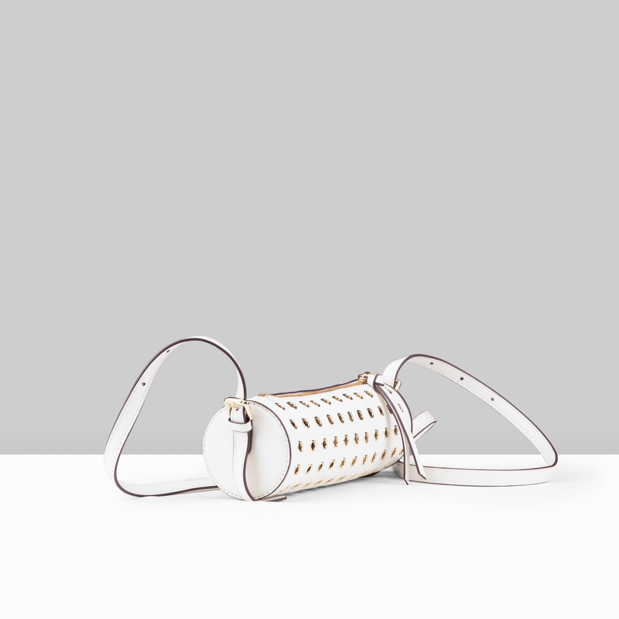 Stephanie Barrel Bag in White Leather – Angled Side View Showing Cylindrical Silhouette, Gold Eyelet Studs, and Adjustable Crossbody Strap | Lodis 1965