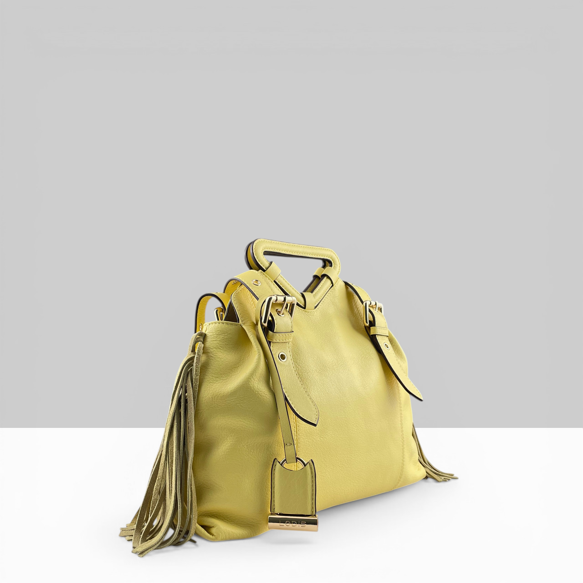 Lodis Skya Tote yellow leather women's handbag with fringe tassel detail and gold hardware – side view