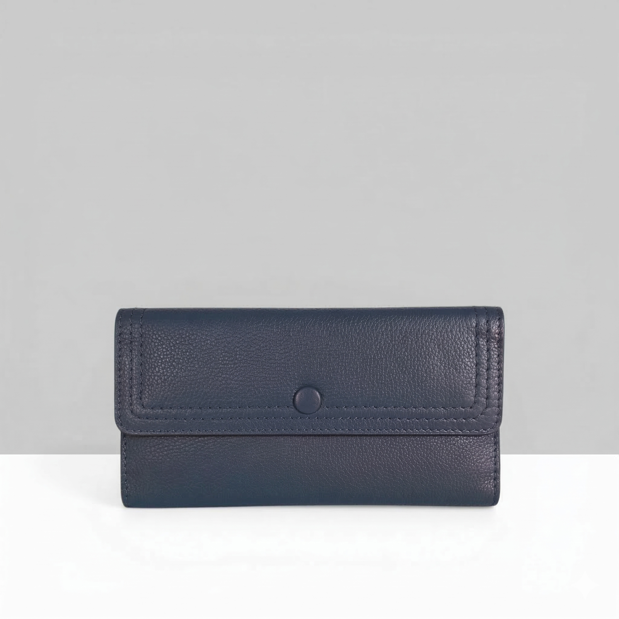 Lodis Kiara Large Flap Wallet in evening blue pebbled leather with snap closure – front view