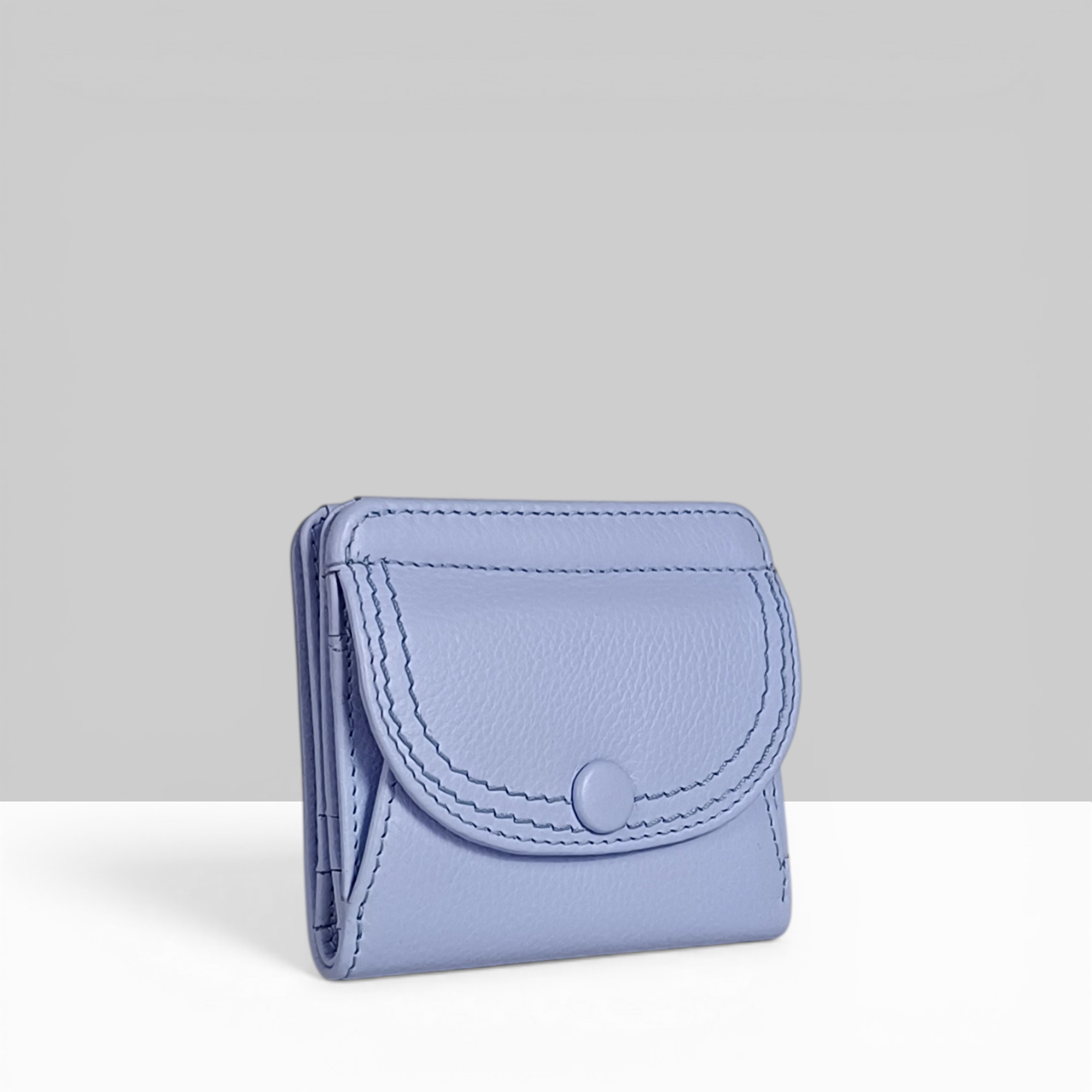 Lodis Kiara Envelope Card Wallet in aura lavender pebbled leather with snap closure – side angle view