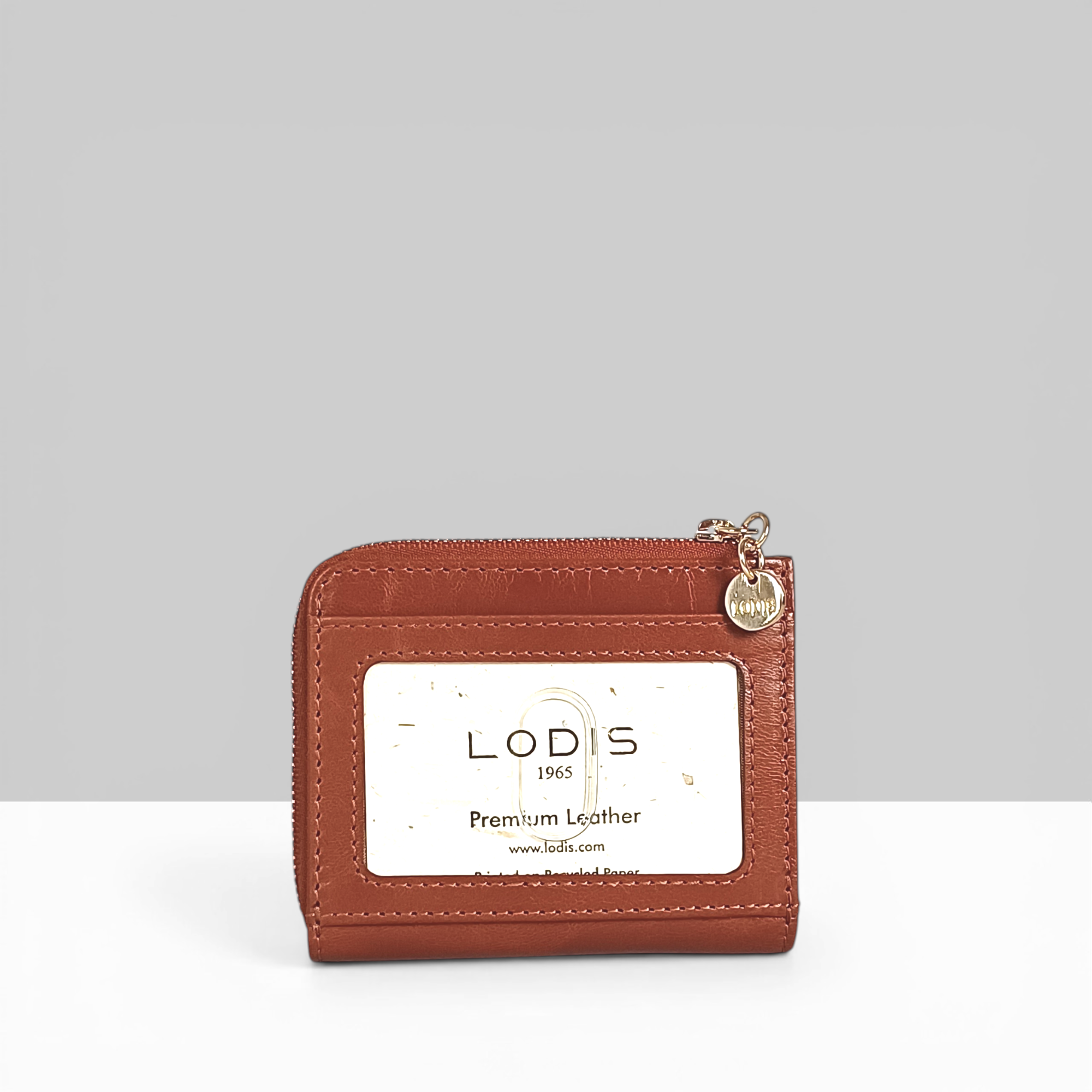 Overglow French L Zip Wallet in Chestnut Pebbled Leather – Back View Showing Lodis 1965 Premium Leather Branding Card and Gold Zip Charm | Lodis 1965