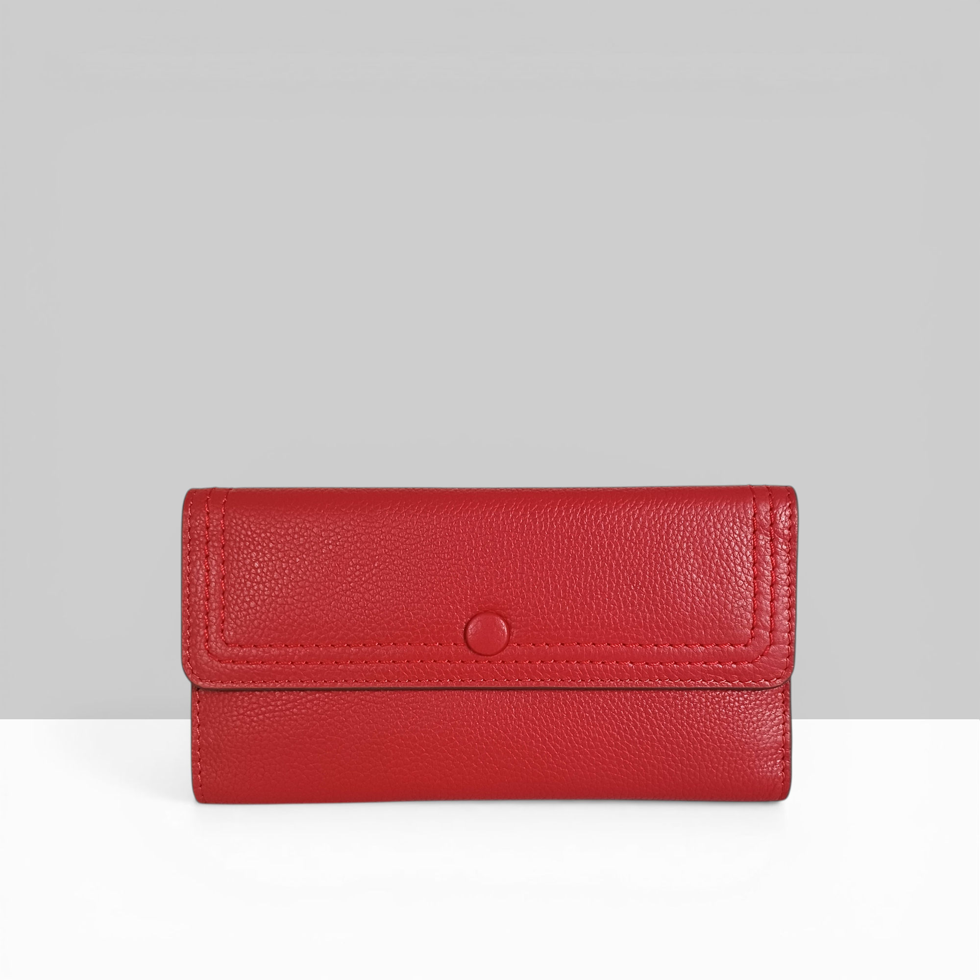Lodis Kiara Large Flap Wallet in rhythmic red pebbled leather with snap closure – front view