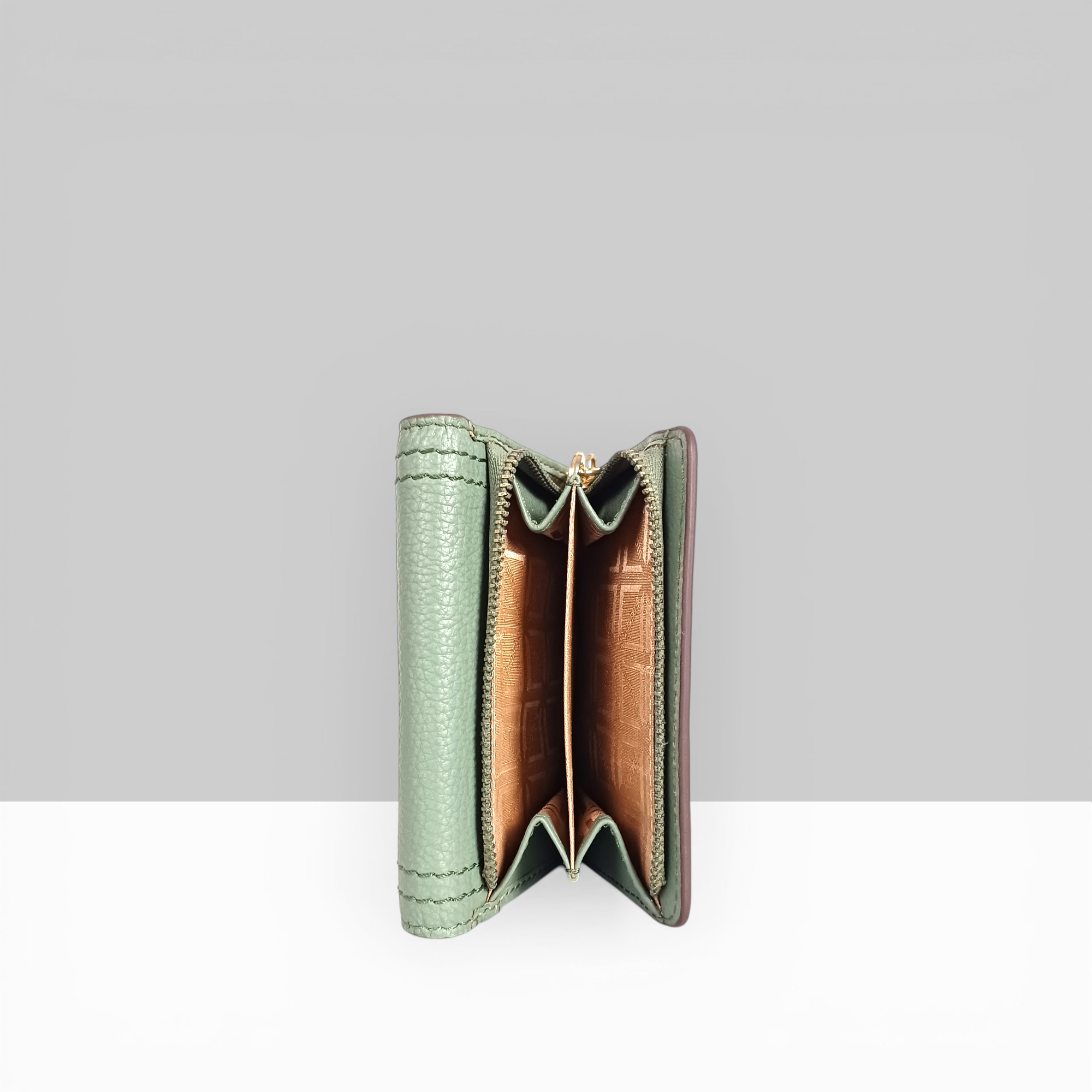 Lodis Kiara French Purse in sage green pebbled leather open side view showing zip coin pocket and tan interior lining