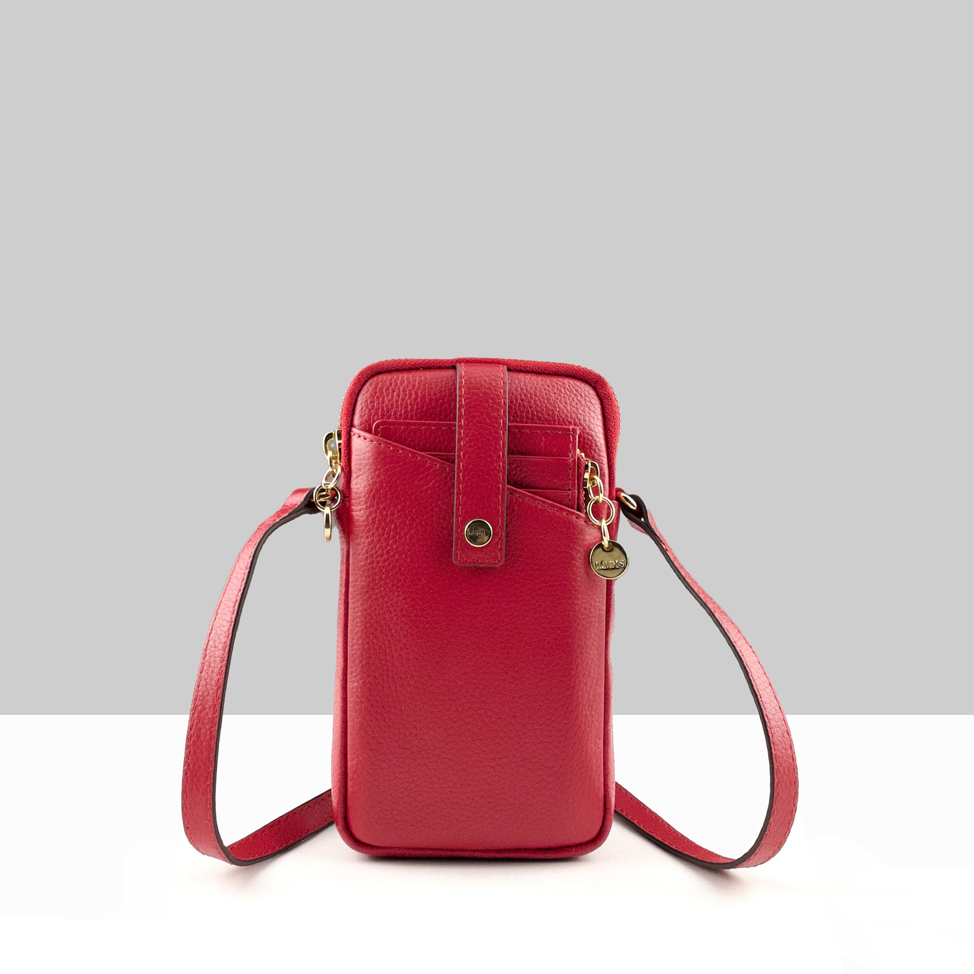 Lodis Catalina City Sling red pebbled leather crossbody phone bag with snap closure, front pocket, and gold hardware