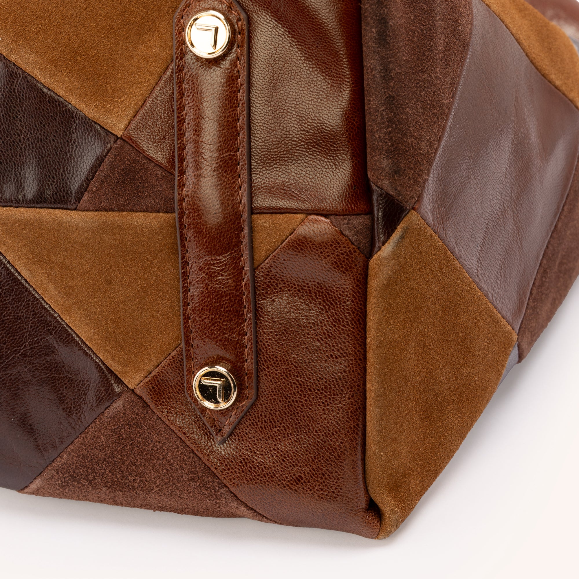 Piece Train Hobo in Chestnut Multi Suede Leather – Close-Up Detail of Gold Hardware Studs and Mixed Suede and Pebbled Leather Patchwork | Lodis 1965