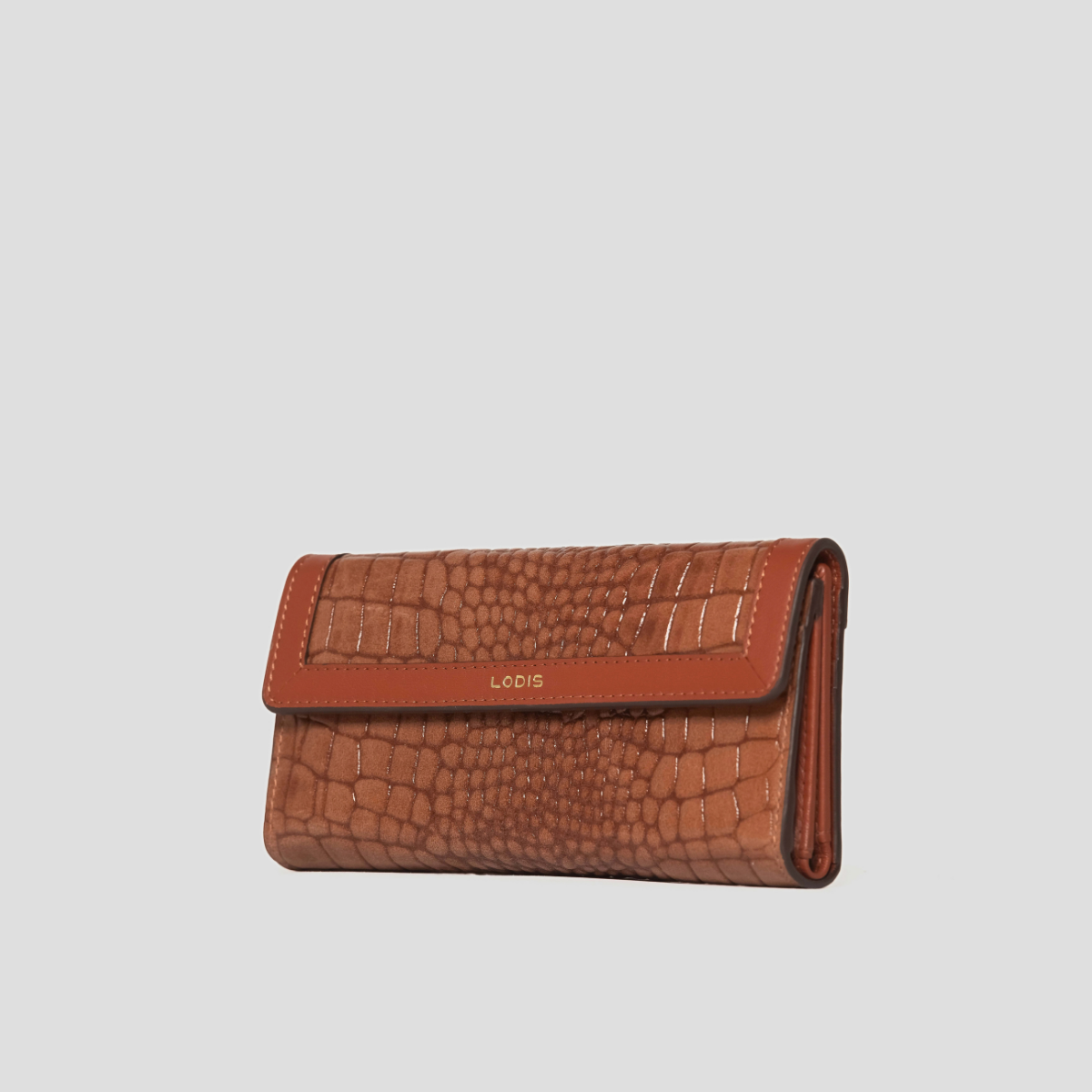 Lodis Amara Checkbook Clutch in Chestnut - Three-Quarter Angle Showing Flap Closure, Slim Profile and Glossy Croco-Embossed Cognac Leather | Lodis 1965