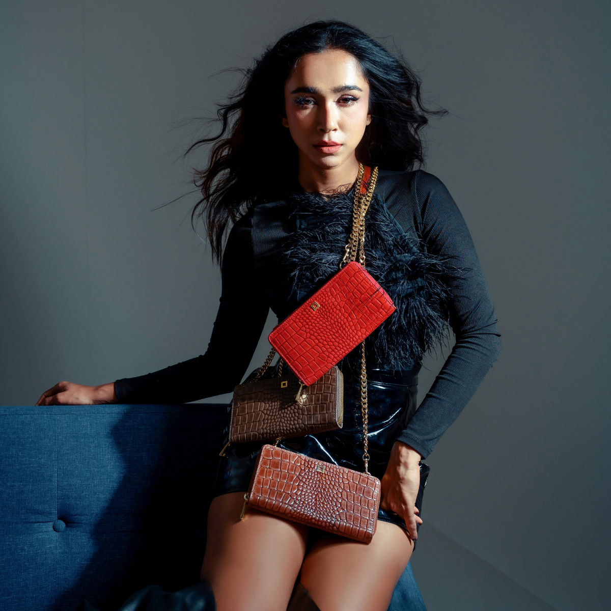Woman Wearing Lodis Amara Sling Crossbody Layered with Coordinating Lodis Bags - Fall Lifestyle Shot with Black Lace Top in Studio Setting, Glossy Croco-Embossed Leather and Gold-Tone Chain | Lodis 1965