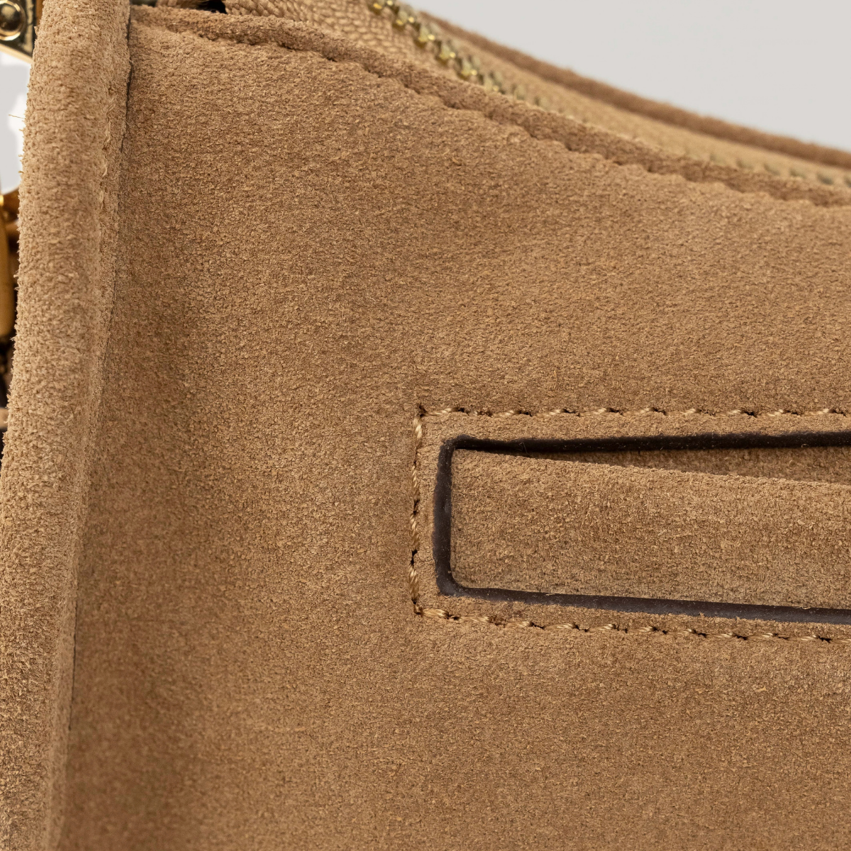 Lodis Axis Crossbody in Saddle - Close-Up of Exterior Slip Pocket with Texas Leather Trim and Contrast Stitching on Camel Suede | Lodis 1965