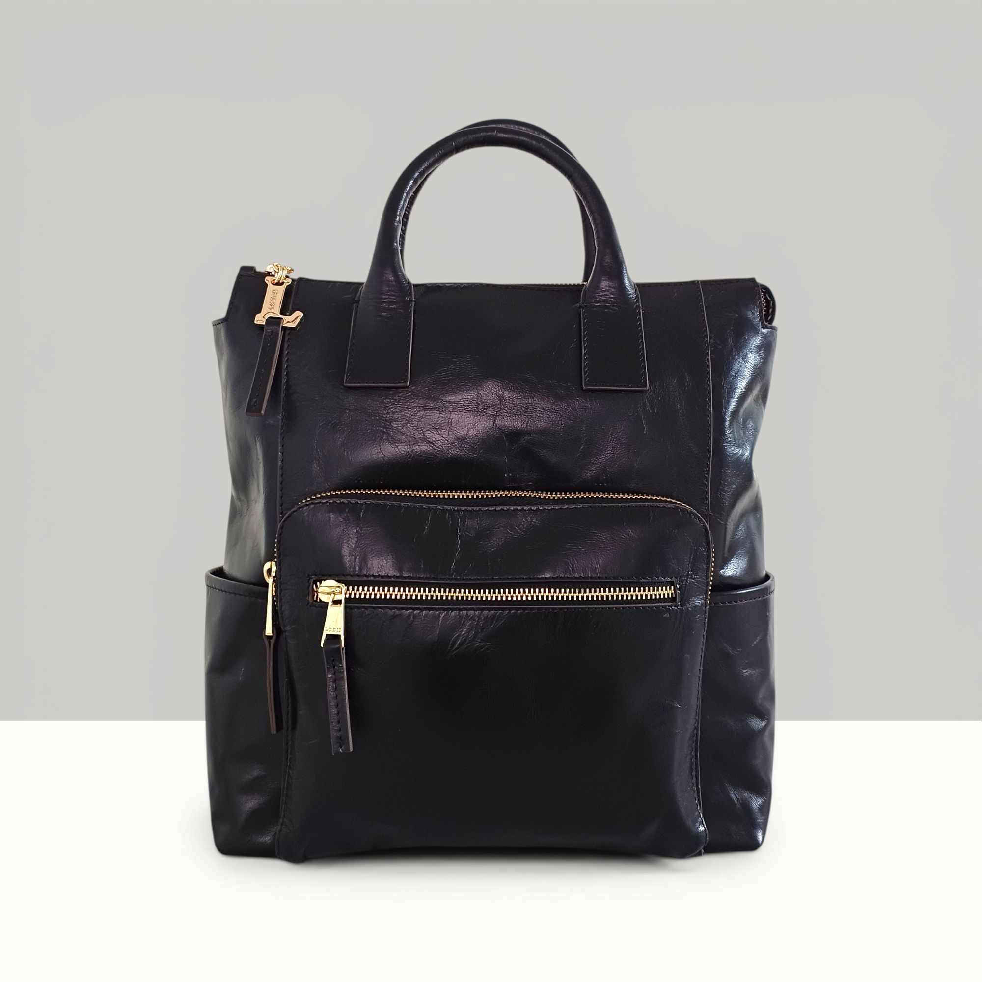 Lodis Catalina 2.0 Leather Backpack in Black – Front View, Drum Dyed Leather with Gold-Tone Front Zip Pocket, Top Handle, and Side Pockets | Lodis 1965