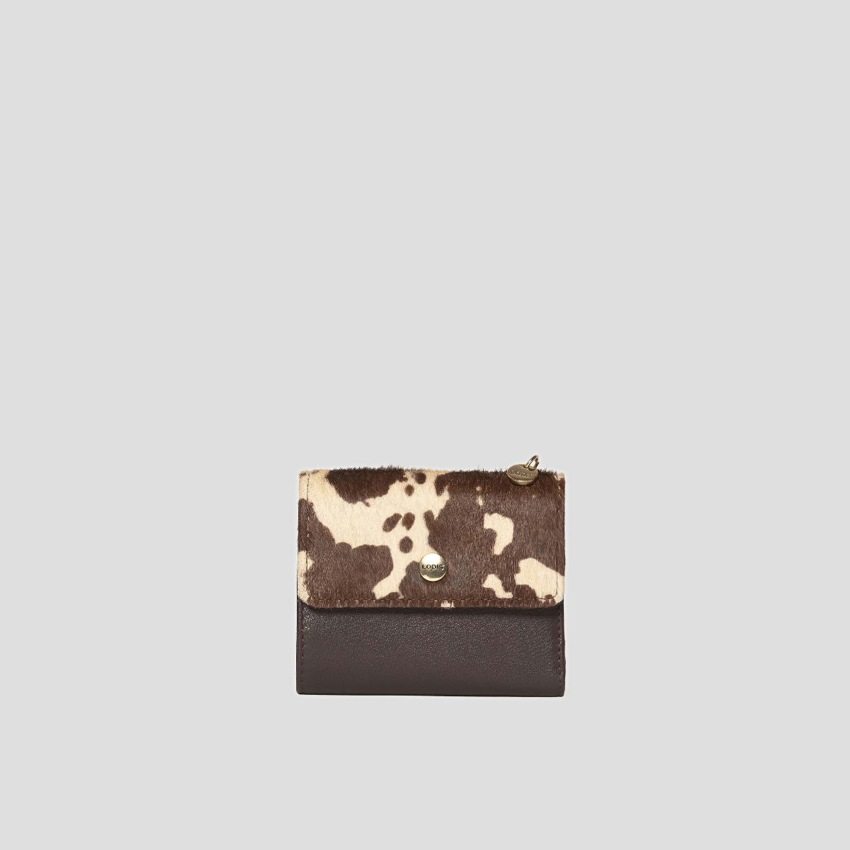 Lodis Graze French Purse in Haircalf - Front View, Brown and Cream Cow Print Haircalf Flap with Dark Brown Texas Leather Body, Gold-Tone Snap Closure and Lodis Coin Zip Charm | Lodis 1965