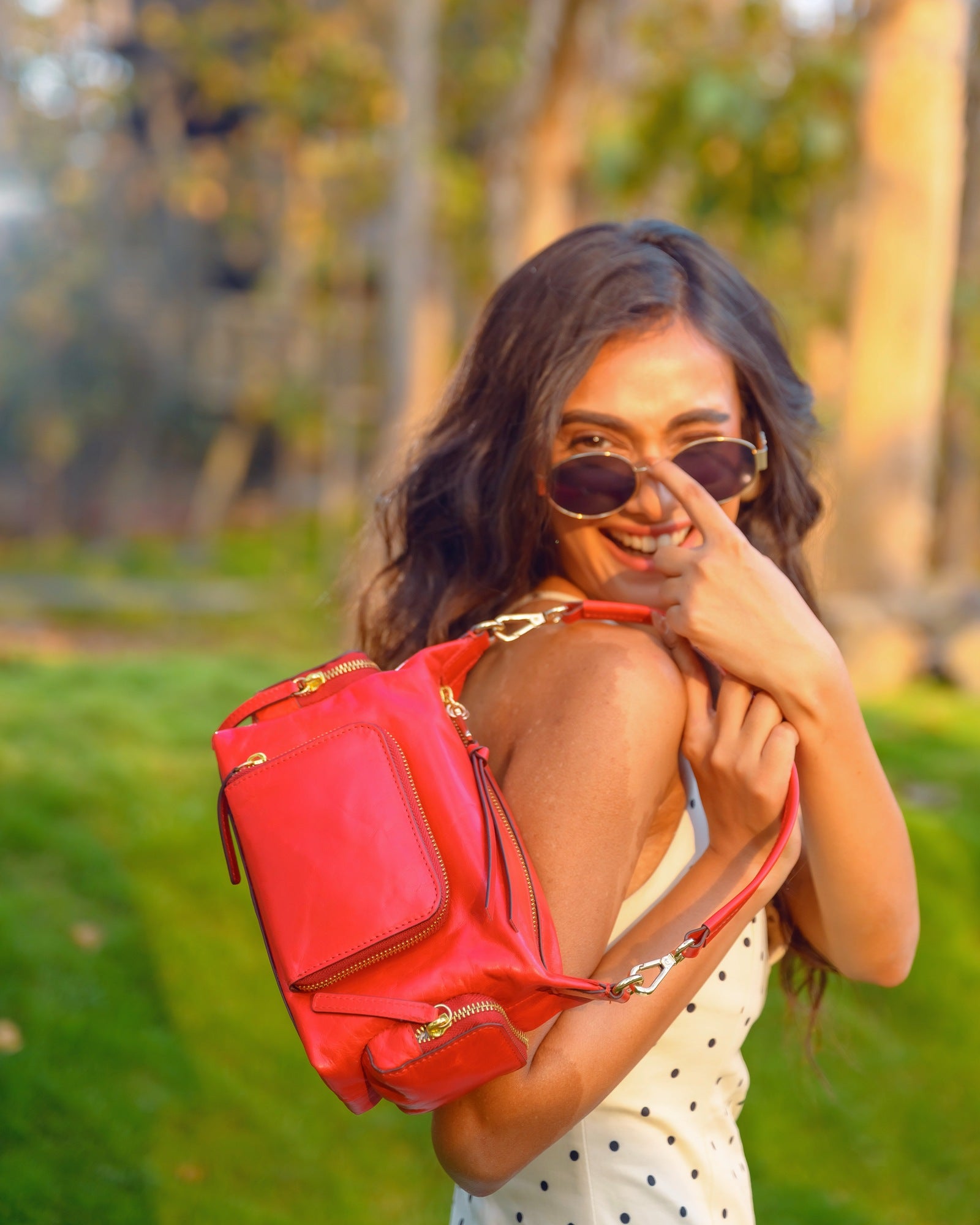 Woman Carrying Lodis Jill TH Crossbody in Rhythmic Red – Polished Genuine Leather Crossbody Bag, Spring-Summer 2026 | Lodis 1965