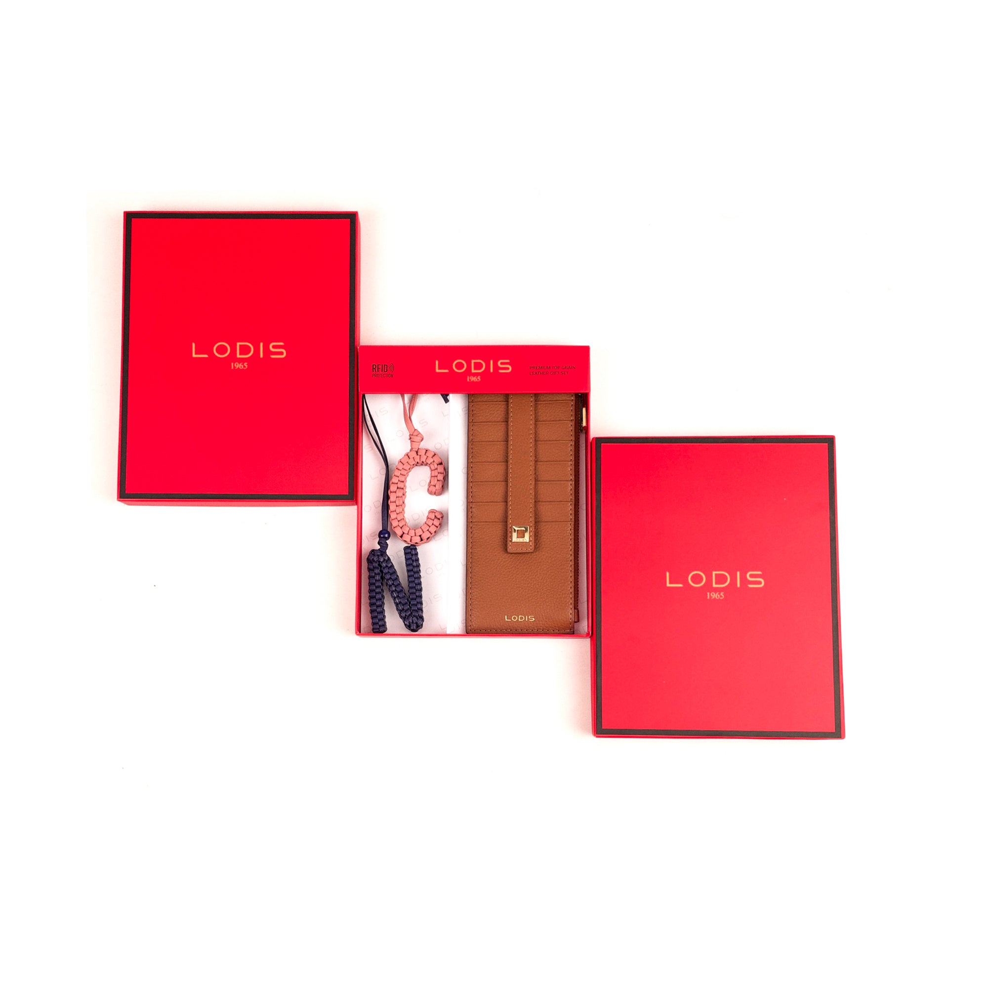 Lodis Personalized Julia Card Case Gift Set in Chestnut – Flat Lay Showing Tan Pebbled Leather Card Case with Personalized Letter Charm and Red Lodis Gift Box | Lodis 1965