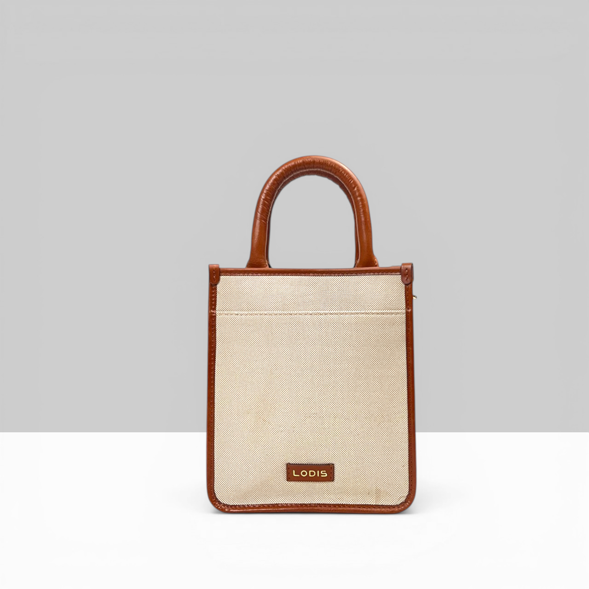 Lodis Kiara City Crossbody in Chestnut – Back View Showing Exterior Slip Pocket and Lodis Logo Plate on Blended Fabric Body | Lodis 1965