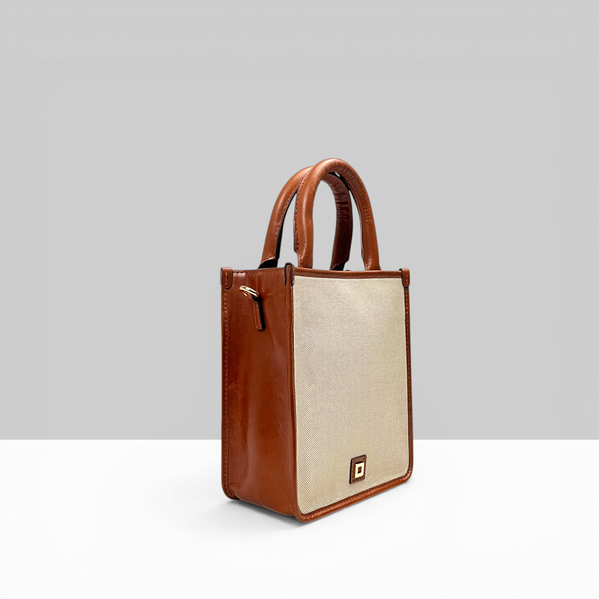Lodis Kiara City Crossbody in Chestnut – Front View, Blended Fabric Body with Chestnut Leather Trim, Top Handle and Logo Plate | Lodis 1965