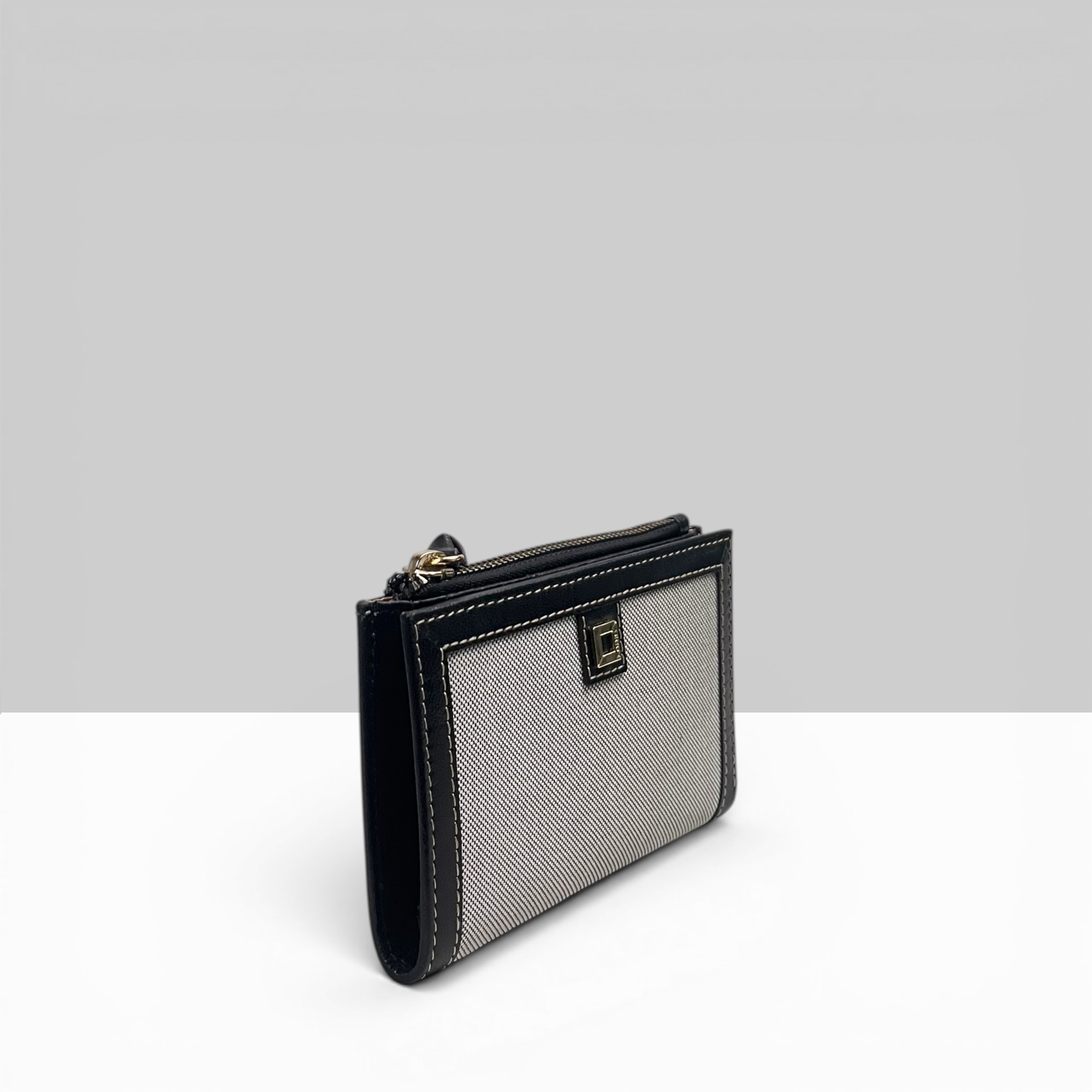 Lodis Kiara French Purse in Black – Side Profile View Showing Zip Closure, Fabric Texture and Black Leather Trim Detail | Lodis 1965