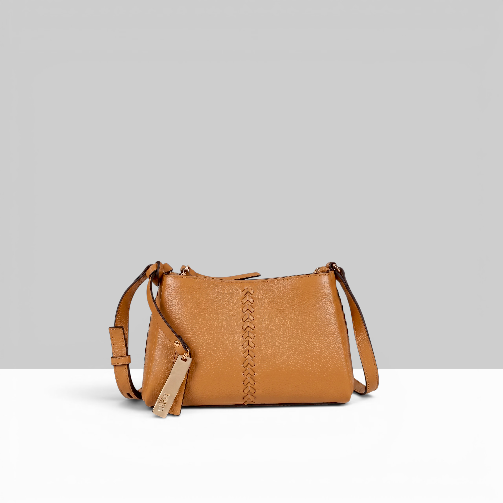 Lodis Nicks Crossbody in Pumpkin Spice - Front View, Genuine Suede Leather with Whipstitch Detail and Gold-Tone Logo Tag | Lodis 1965