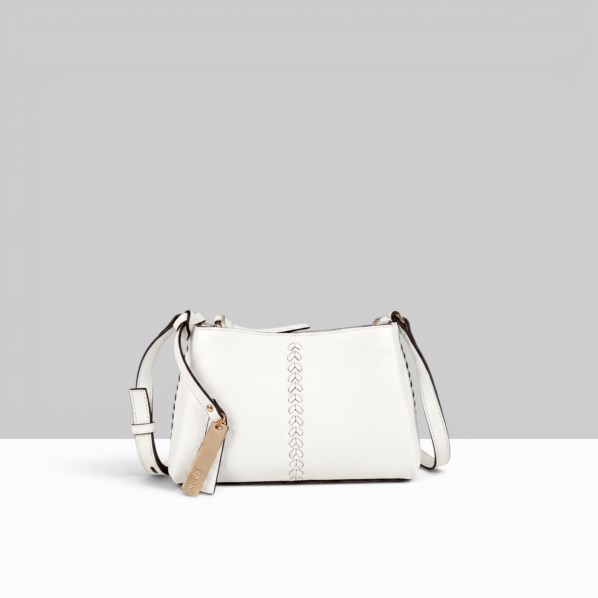 Lodis Nicks Crossbody in White - Front View, Genuine Suede Leather with Whipstitch Detail and Gold-Tone Logo Tag | Lodis 1965