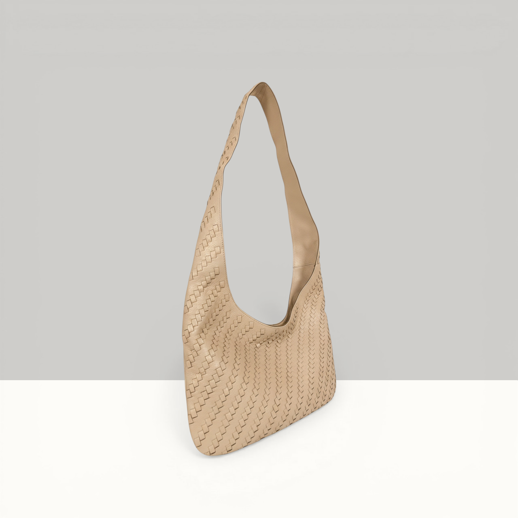 Lodis Solstice Hobo in Sand – Side Profile View, Full Woven Pebbled Leather Texture and Single Shoulder Strap | Lodis 1965