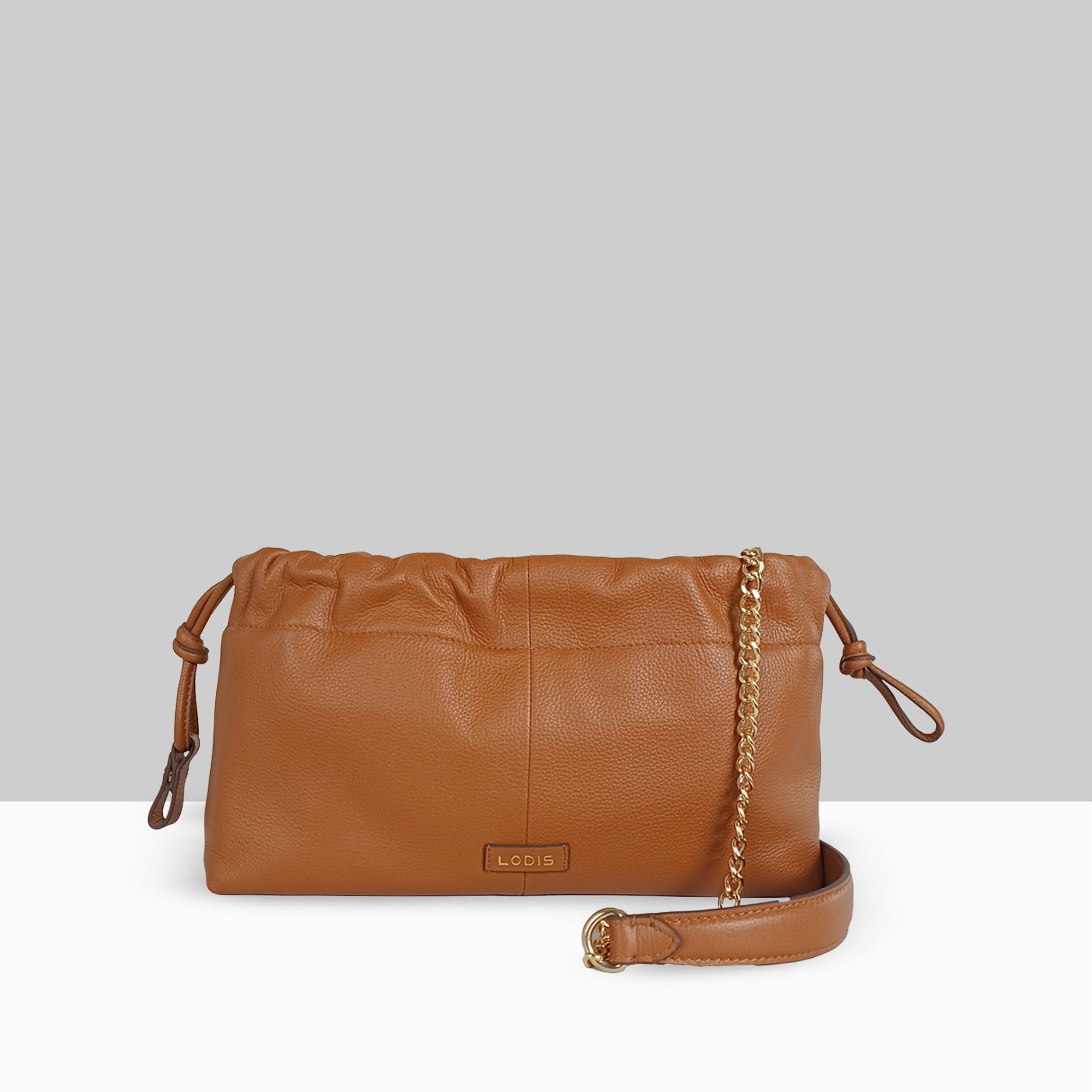 Lodis Solstice Pouch in Chestnut – Back View Showing Smooth Pebbled Leather, Embossed Lodis Logo Plate, and Gold-Tone Chain with Crossbody Strap | Lodis 1965