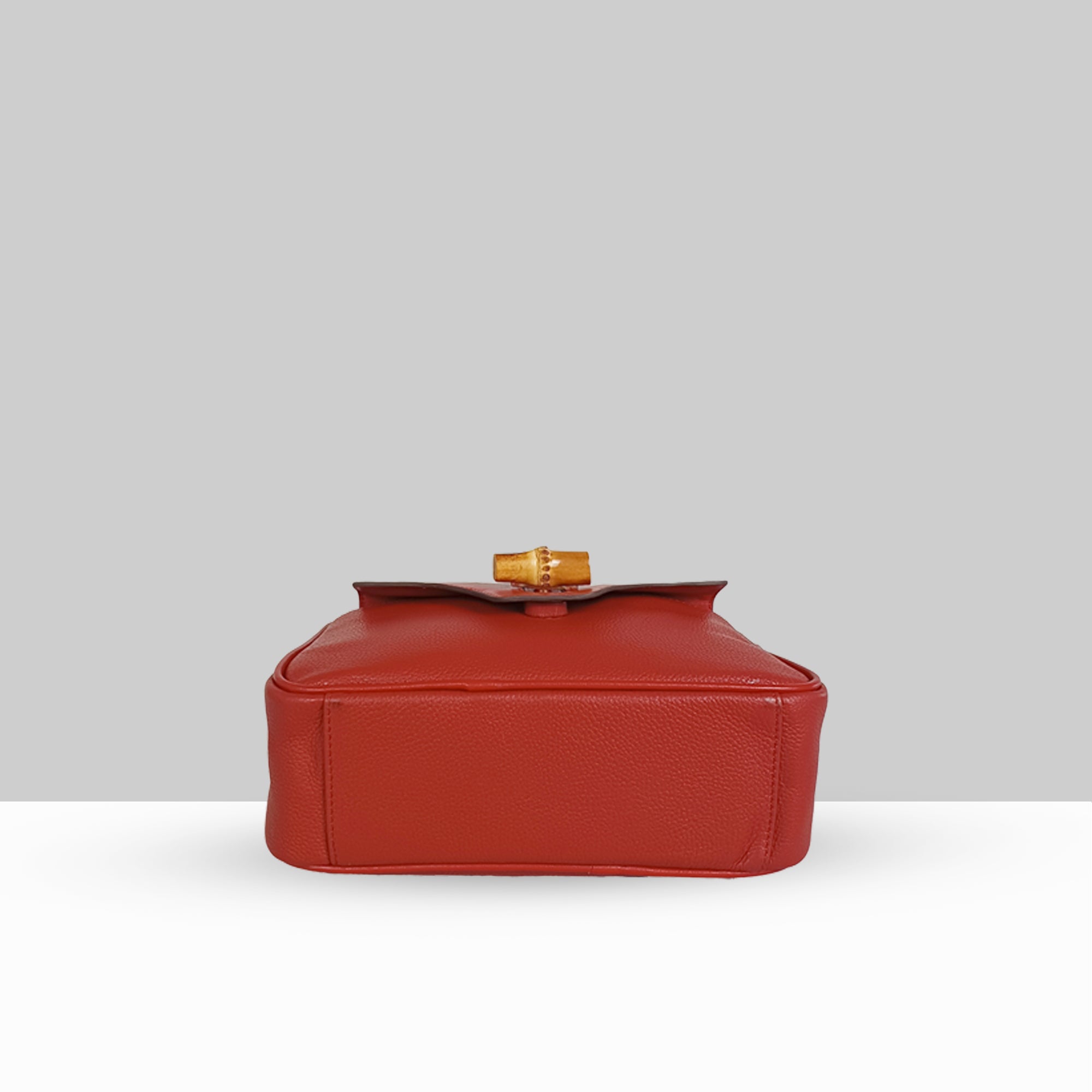 Lodis Sondra Camera Bag in Rhythmic Red – Base View Showing Structured Bottom, Drum Dyed Pebbled Leather Texture, and Bamboo Turn-Lock Hardware | Lodis 1965