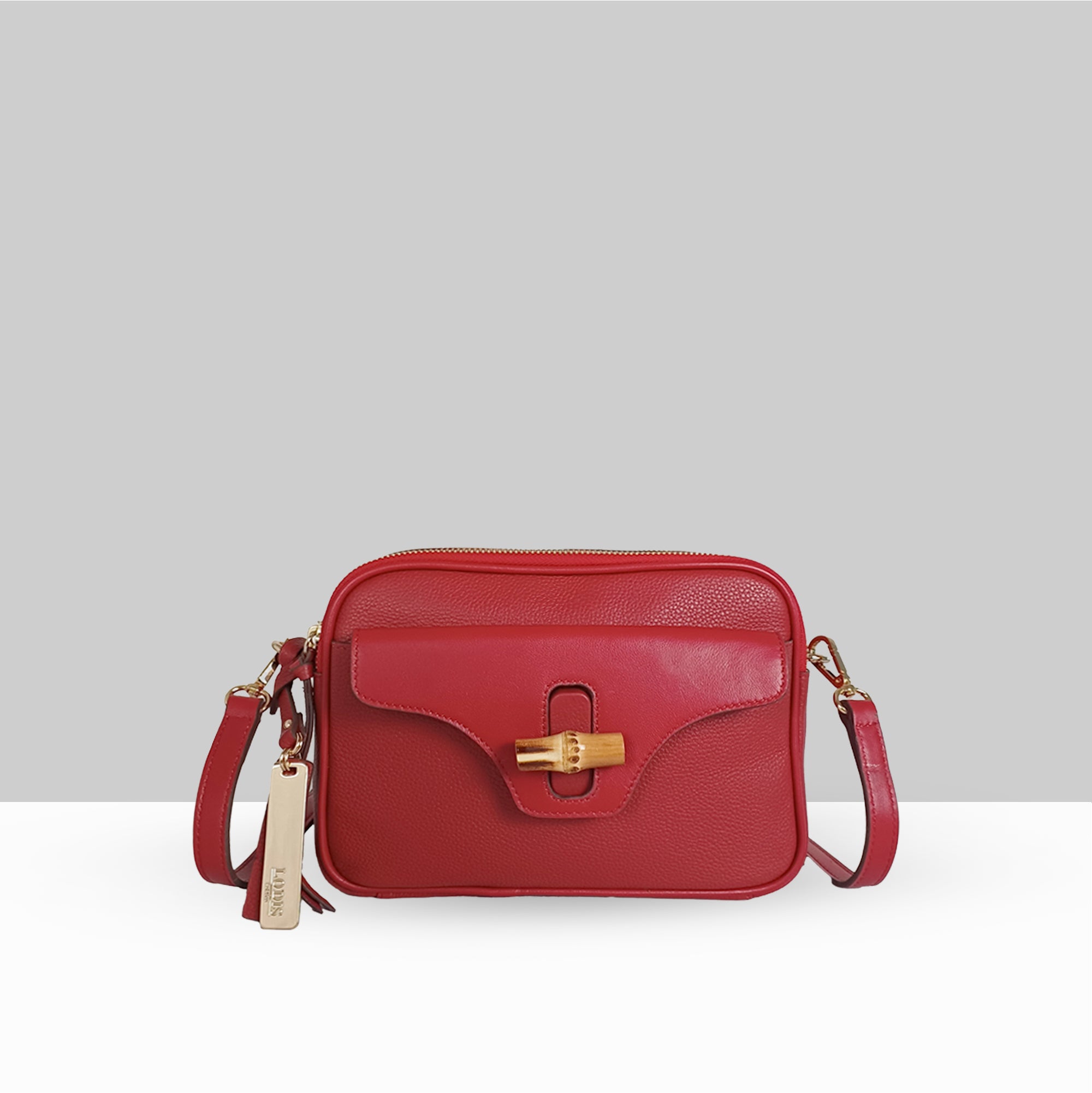 Lodis Sondra Camera Bag in Rhythmic Red – Front View, Drum Dyed Pebbled Leather with Bamboo Turn-Lock Flap, Zip Top, and Adjustable Crossbody Strap | Lodis 1965