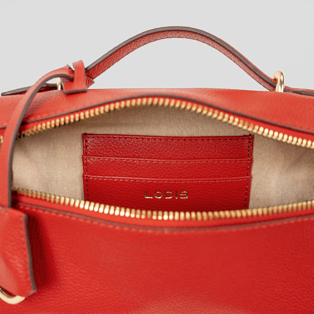 Lodis Stratos Texas Crossbody in Samba - Interior View Showing Zip-Around Opening, Leather Slip Pocket with Lodis Logo and Light Fabric Lining | Lodis 1965