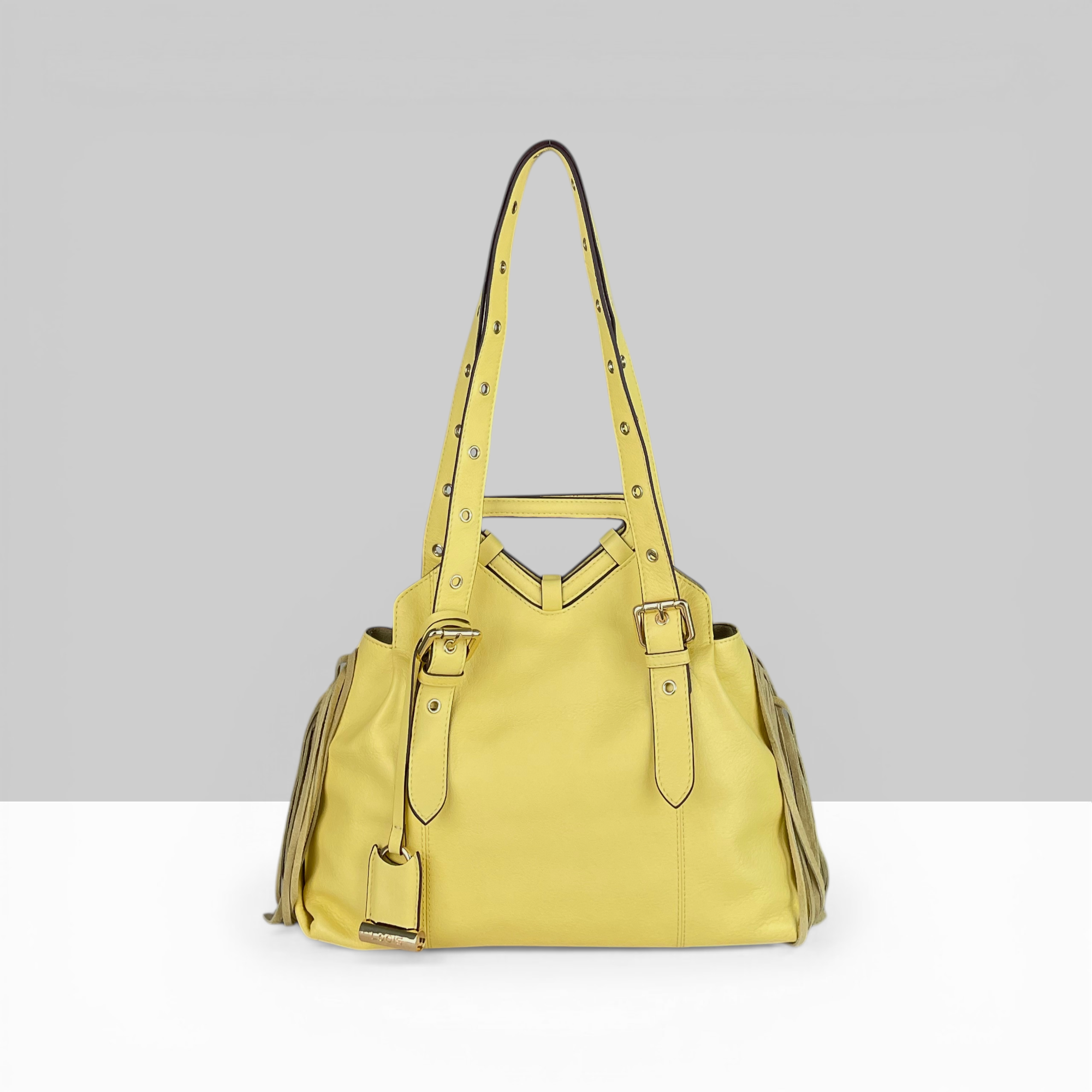Lodis Skya Tote yellow leather women's handbag with long shoulder strap, fringe detail, and gold stud hardware – strap view