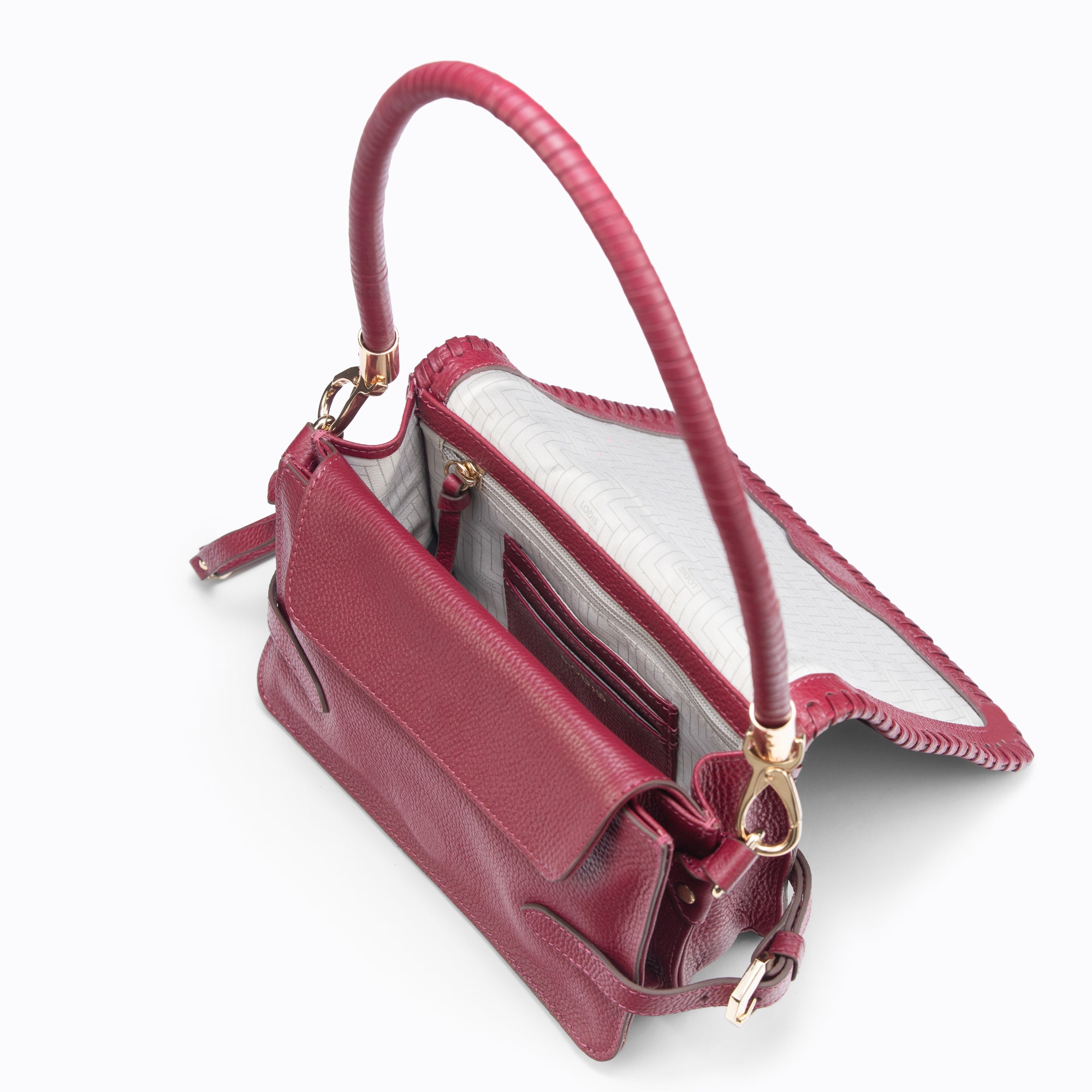 Lodis Elina EW Crossbody wine glazed leather bag open view showing light gray interior lining, card slots, and gold hardware