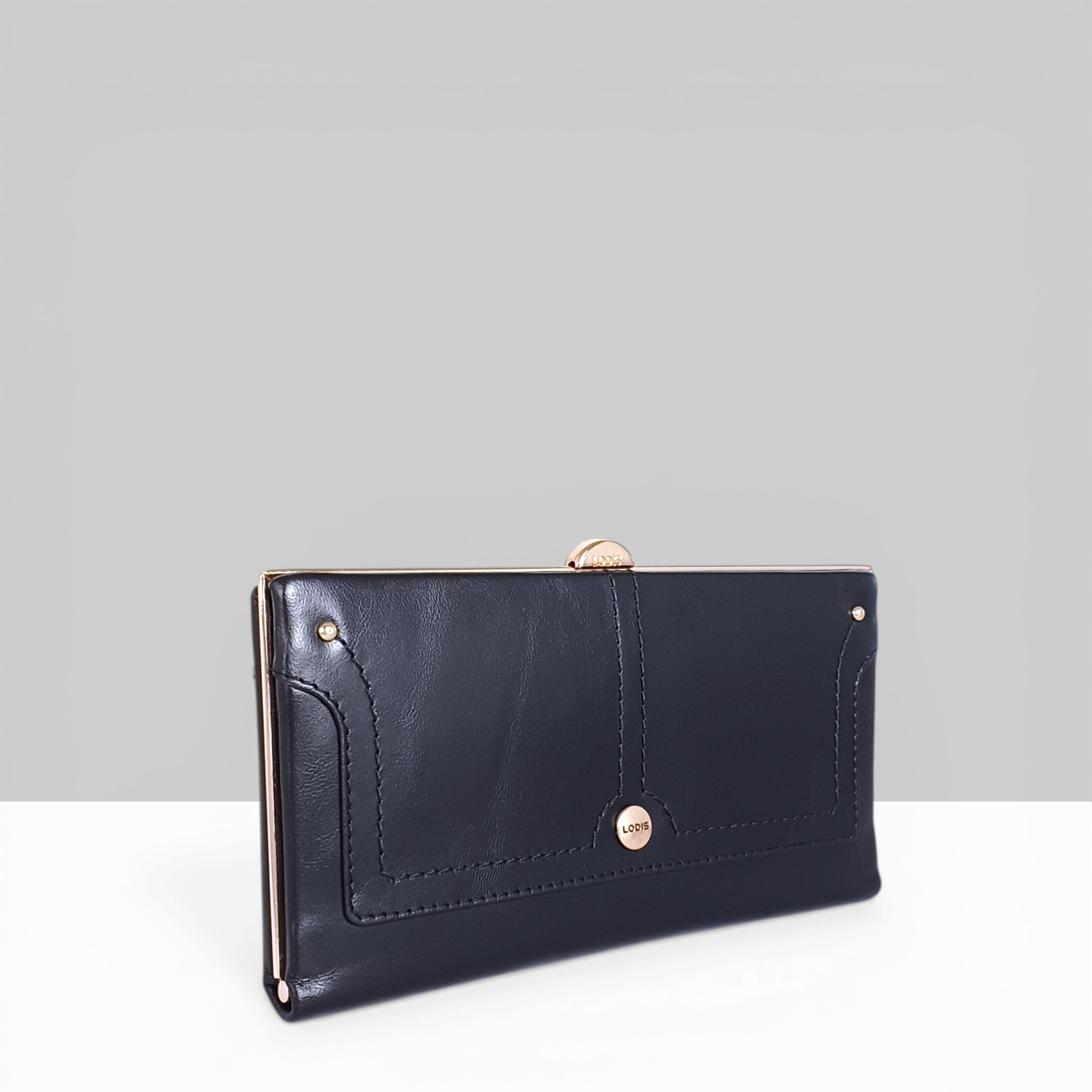 Overglow Clutch Frame Wallet in Black Patent Leather – Angled Side View Showing Rose Gold Frame Hardware and Topstitched Edge Detail | Lodis 1965