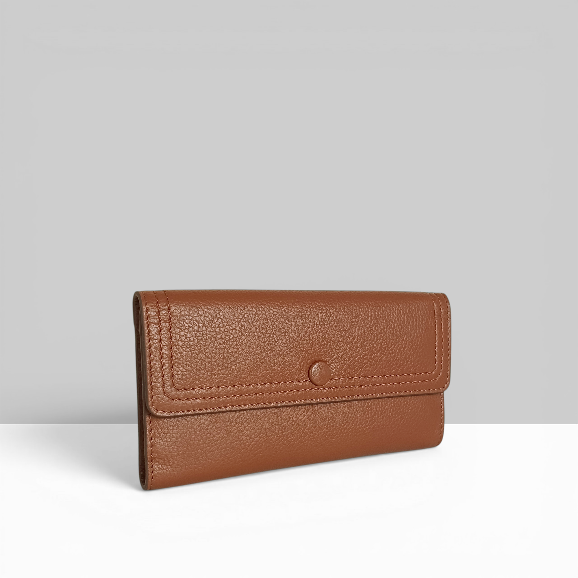 Lodis Kiara Large Flap Wallet in chestnut pebbled leather with snap closure – side angle view