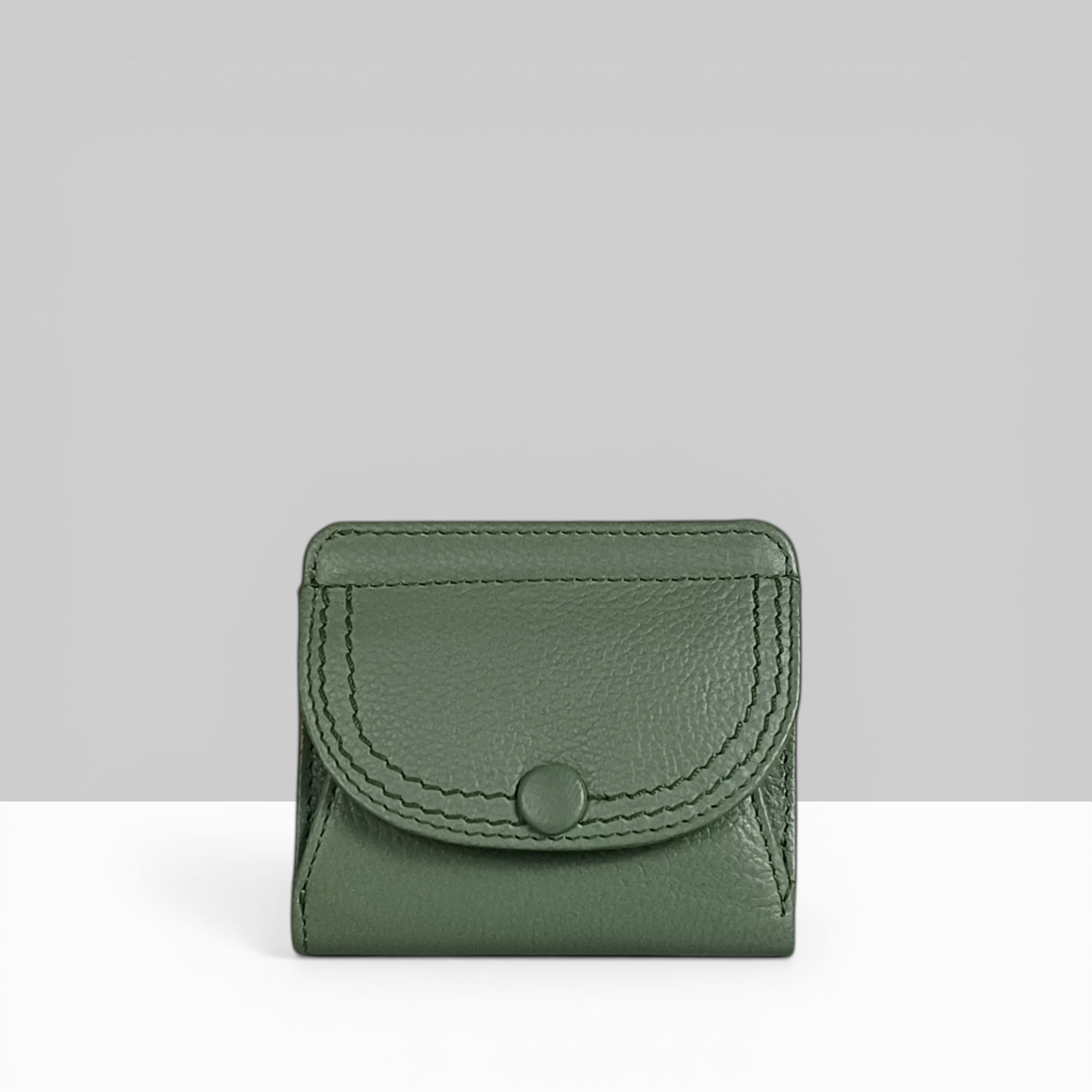 Lodis Kiara Envelope Card Wallet in sage green pebbled leather with snap closure – front view