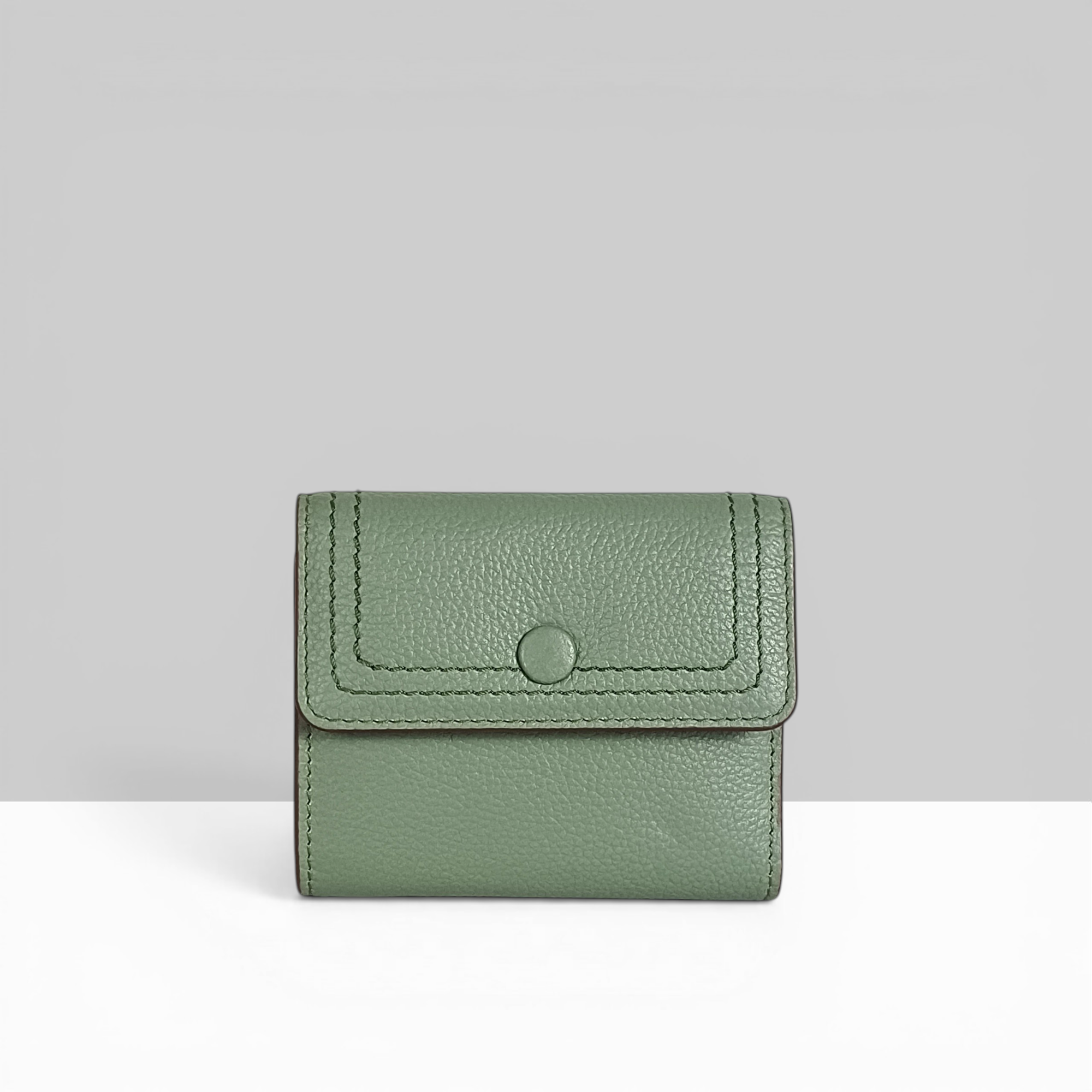 Lodis Kiara French Purse in sage green pebbled leather with snap closure – front view