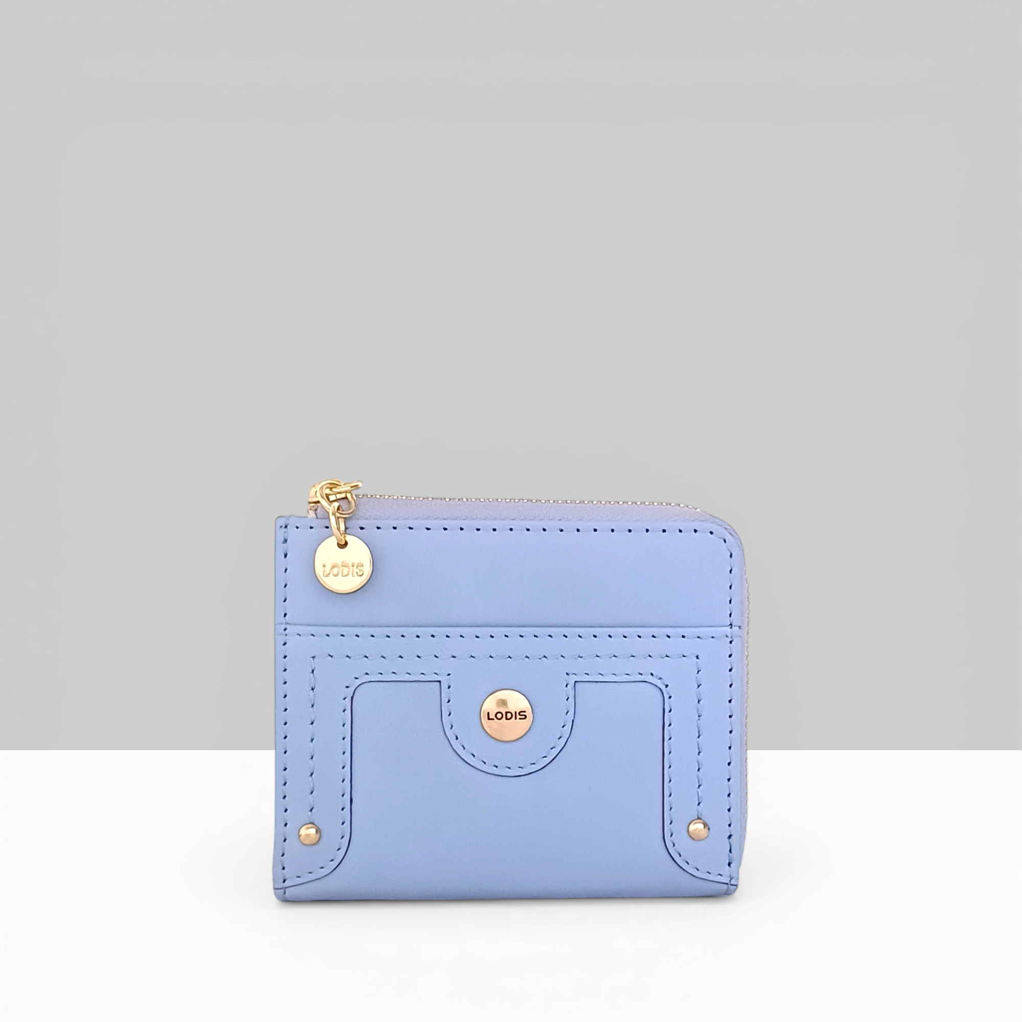 Overglow French L Zip Wallet in Aura Blue Pebbled Leather – Angled View Showing Gold Zip Pull, Logo Charm, and Front Snap Pocket Detail | Lodis 1965