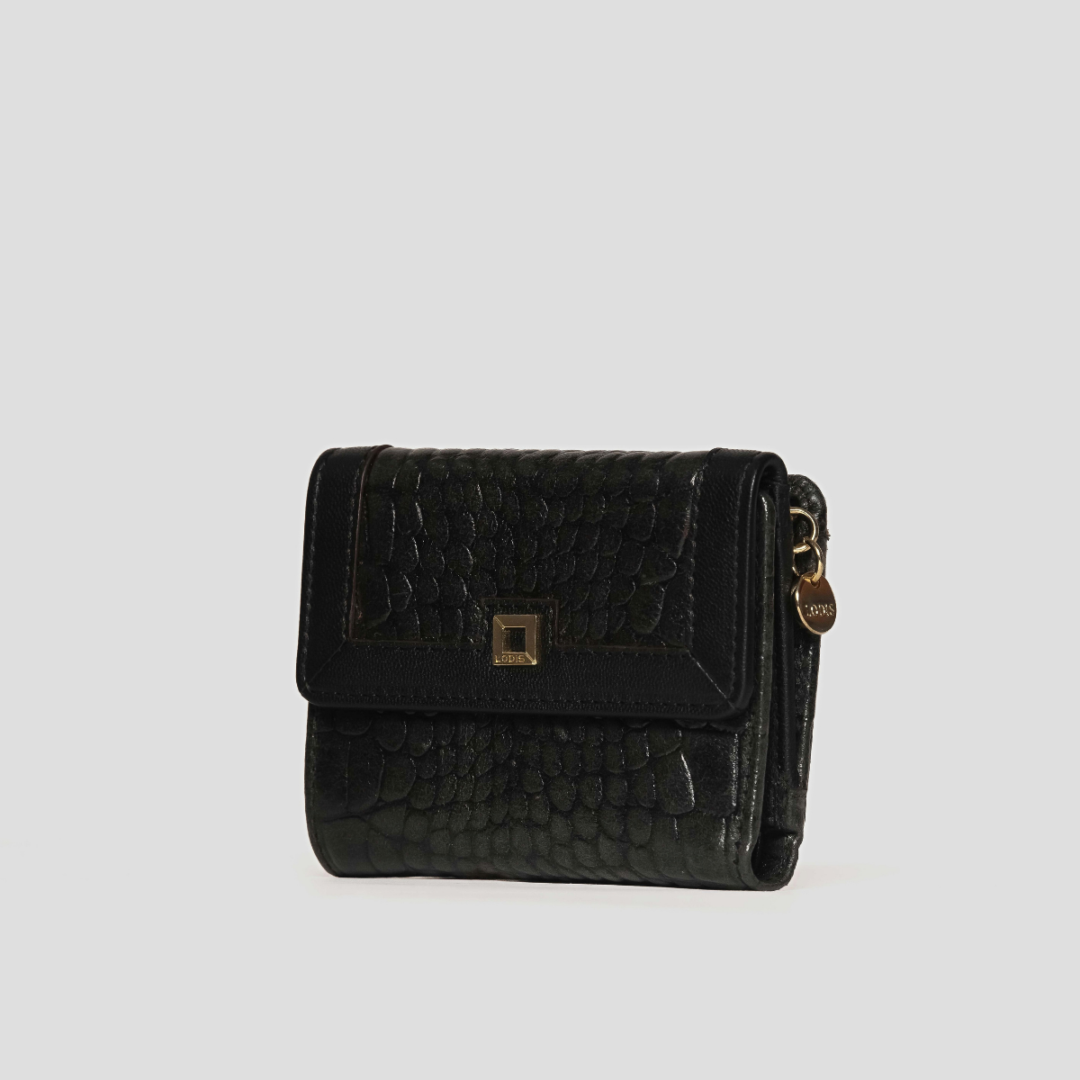 Lodis Amara French Purse in Black - Three-Quarter Angle Showing Flap Closure, Gold-Tone Logo Plate and Side Zip Coin Pocket | Lodis 1965