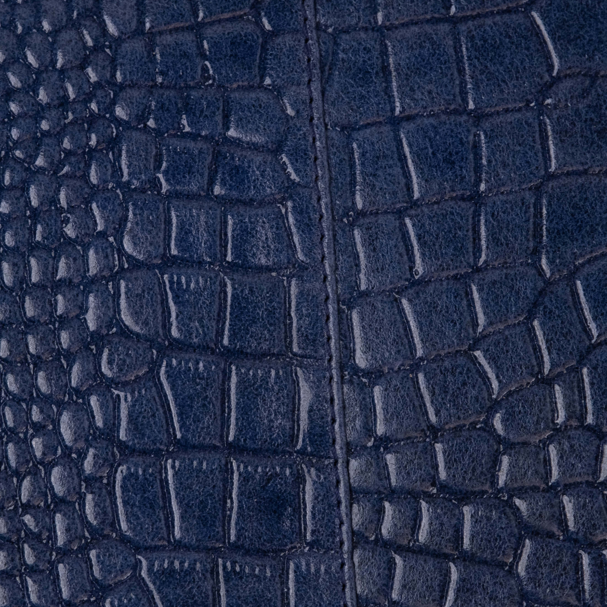 Lodis Amara Zip Pouch in Cobalt - Macro Texture Detail of Navy Blue Glossy Croco-Embossed Leather with Center Seam | Lodis 1965