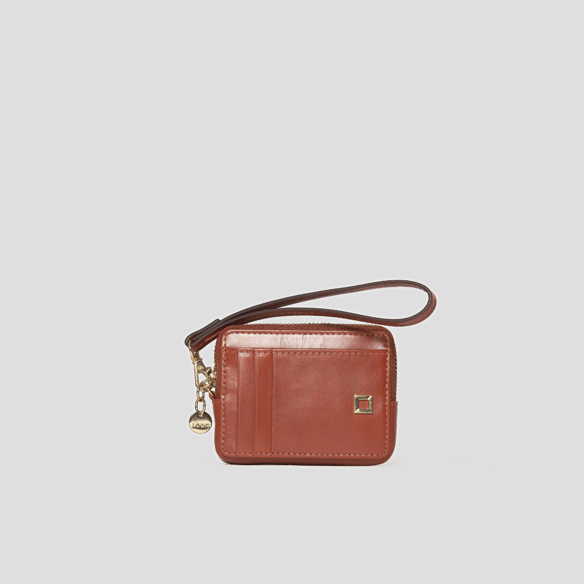 Lodis Blair Trouble Card Case in Rust - Front View, Glazed Leather Zip Card Case with Wristlet Strap, Exterior Card Slots, Gold-Tone Logo Plate and Lodis Coin Charm | Lodis 1965