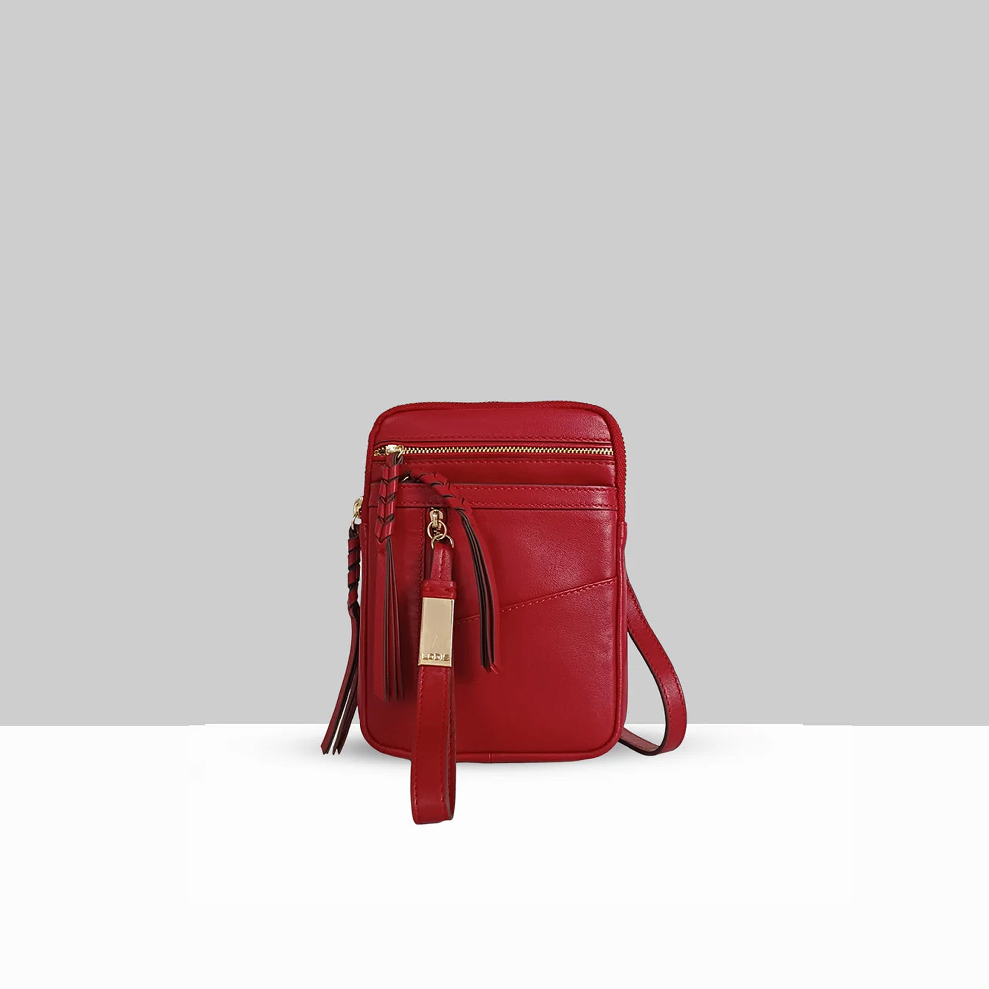 Lodis Catalina 2.0 Phone Crossbody in Rhythmic Red – Front View, Smooth Cow-Hide Leather with Zip Top, Whipstitch Detail, Front Zip Pocket, and Multi-Tassel Accent | Lodis 1965