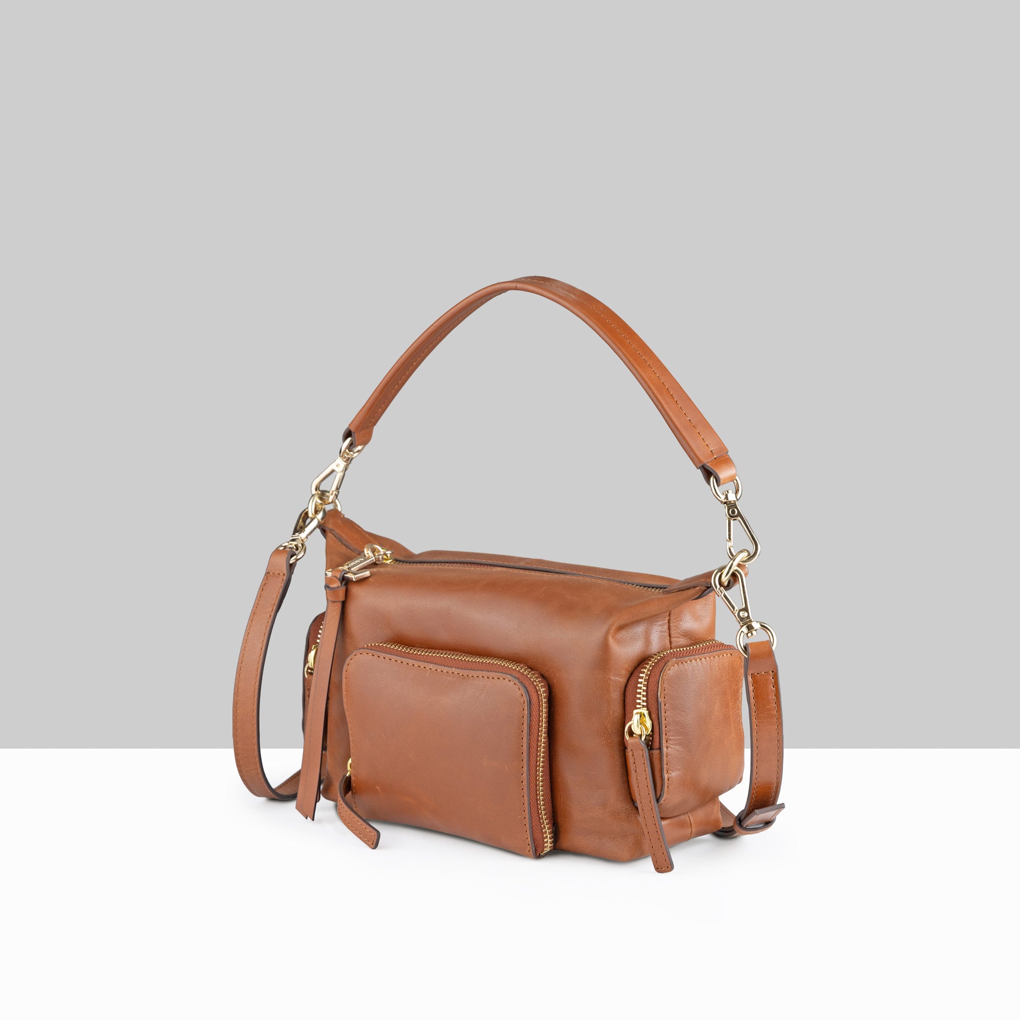 Lodis Jill TH Crossbody in Chestnut – Side Profile View, Polished Genuine Leather with Front Zip Pocket and Gold-Tone Hardware | Lodis 1965