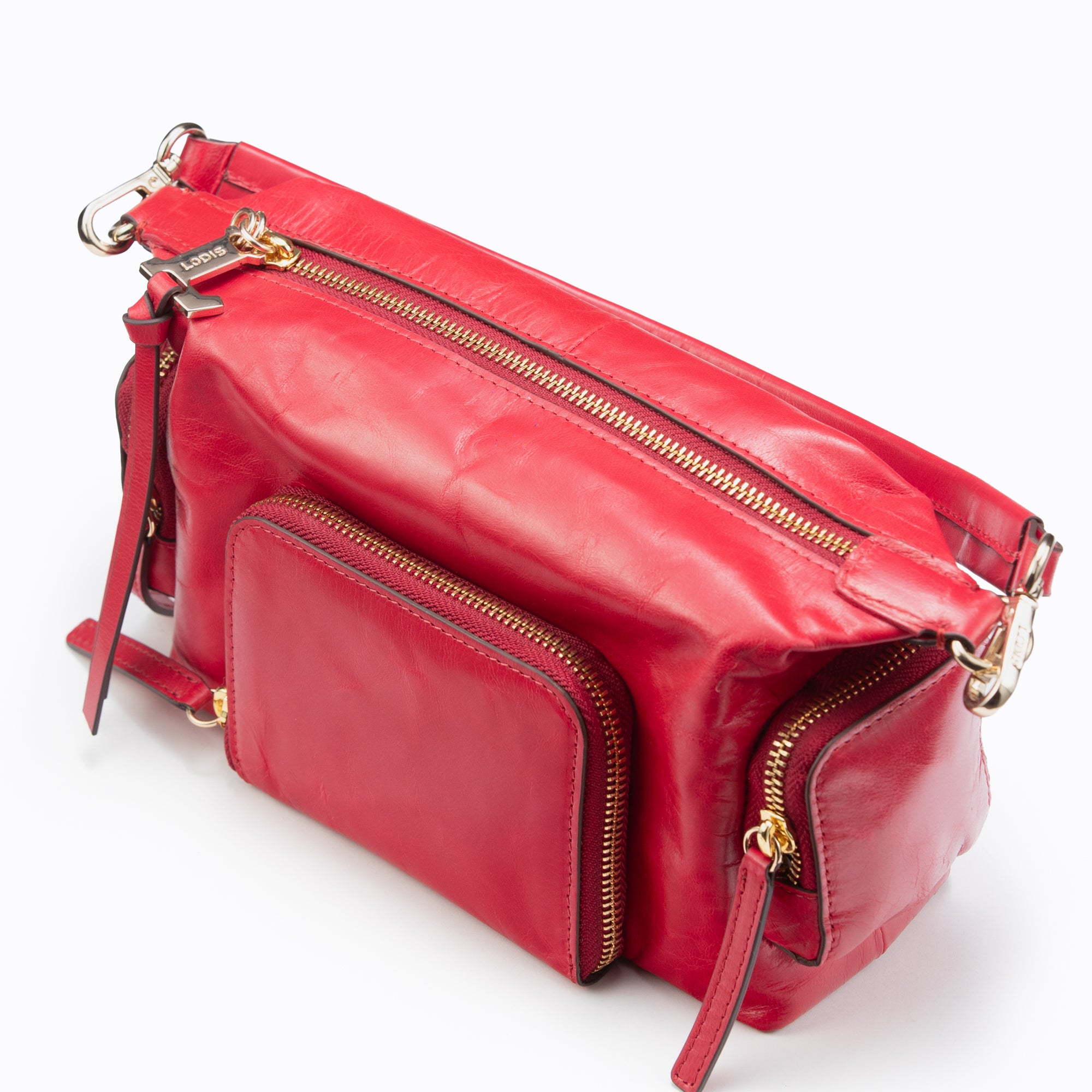 Lodis Jill TH Crossbody in Rhythmic Red – Top Angle View, Polished Genuine Leather with Gold-Tone Zippers and Logo Tag Detail | Lodis 1965