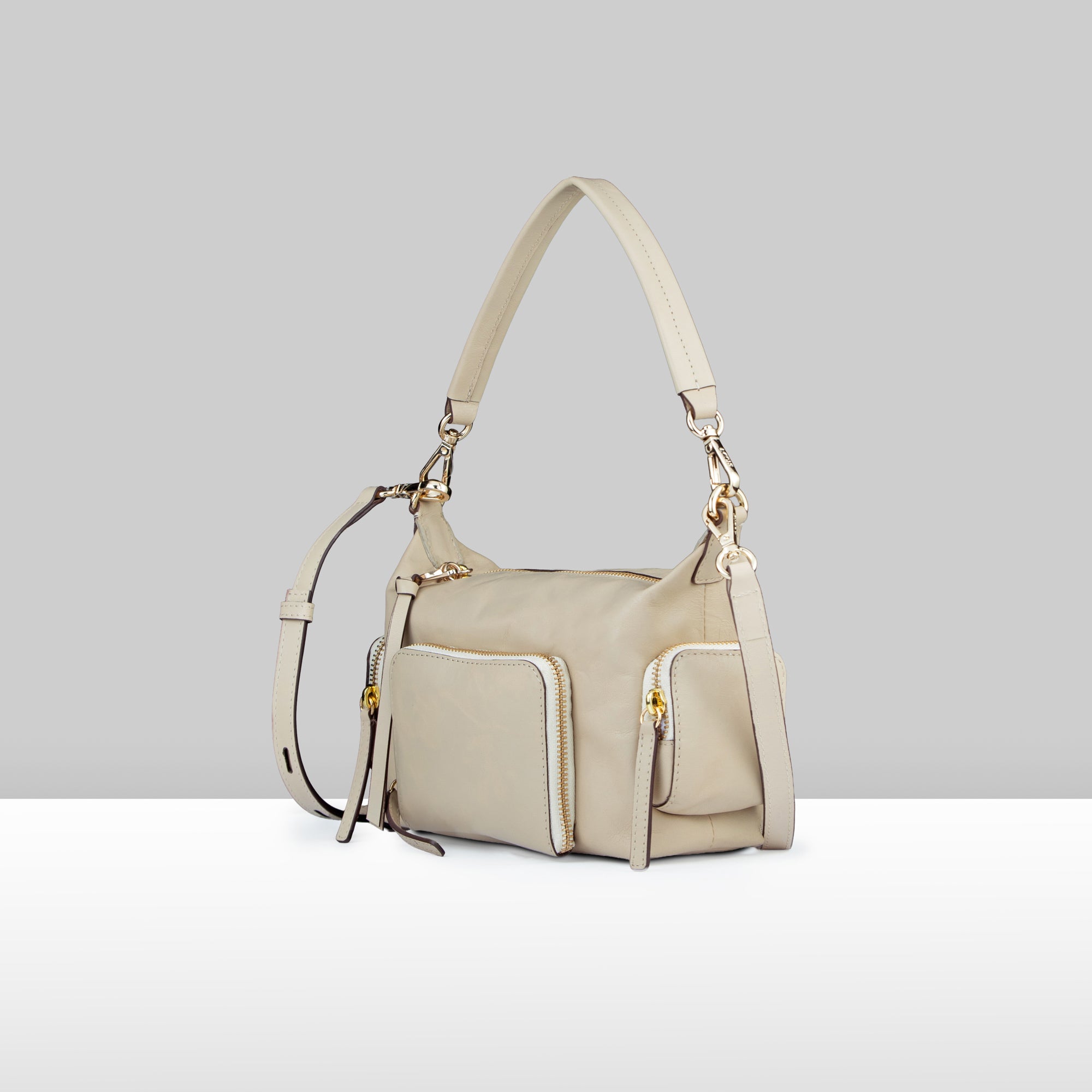 Lodis Jill TH Crossbody in Sand – Side Profile View, Polished Genuine Leather with Front Zip Pocket and Gold-Tone Hardware | Lodis 1965