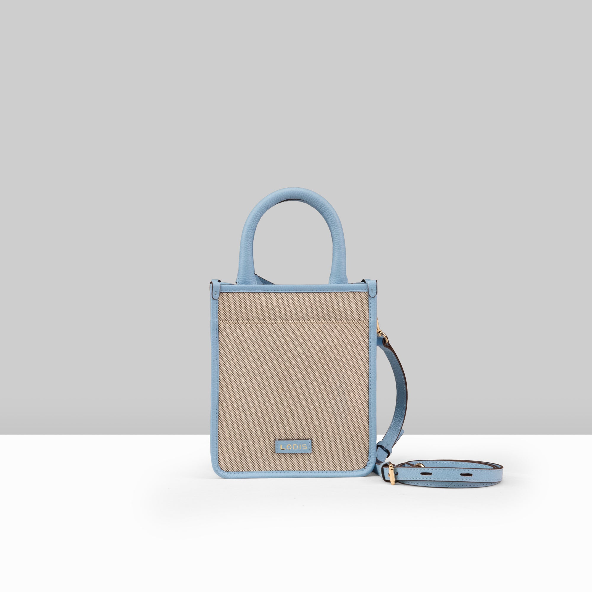 Lodis Kiara City Crossbody in Aura – Back View Showing Lodis Logo Plate, Blended Fabric Body and Adjustable Crossbody Strap | Lodis 1965