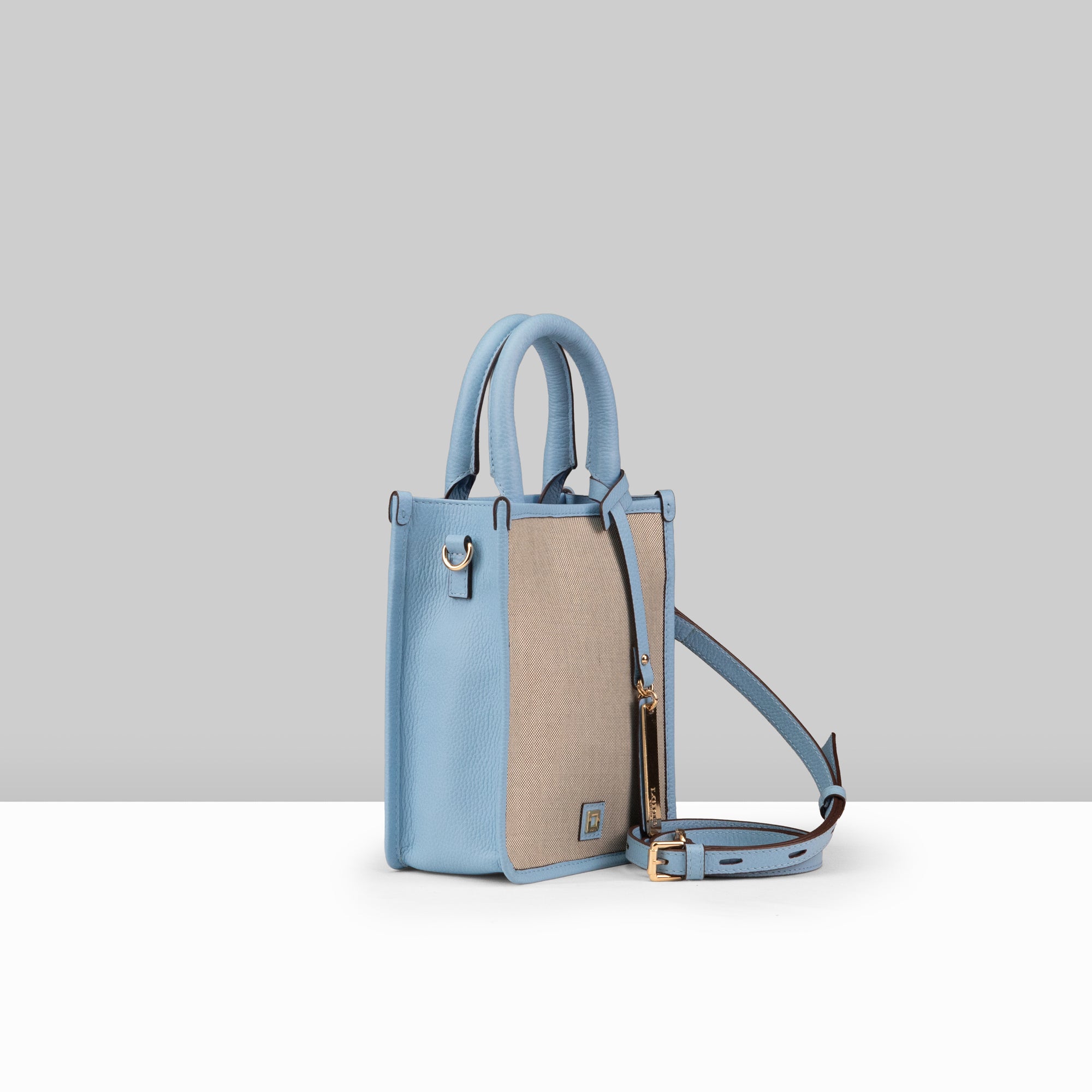 Lodis Kiara City Crossbody in Aura – Side Profile View Showing Adjustable Strap, Bag Depth and Blue Leather Trim Detail | Lodis 1965