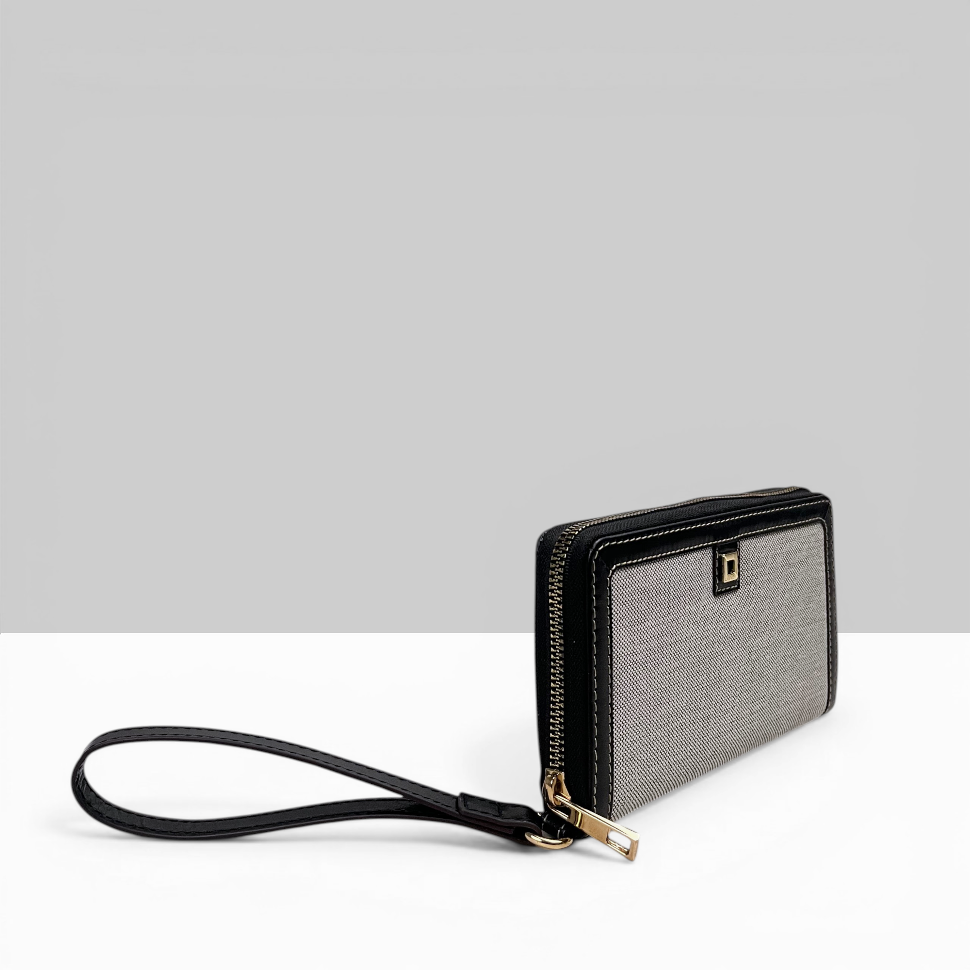 Lodis Kiara Continental Zip Wallet in Black – Side Profile View Showing Gold-Tone Zip Closure and Wristlet Strap | Lodis 1965