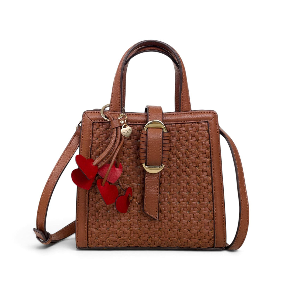 Lodis Leather Heart Bag Charm in Red Clipped to a Woven Cognac Leather Satchel – Shown as a Handbag Accessory with Gold-Tone Ring | Lodis 1965
