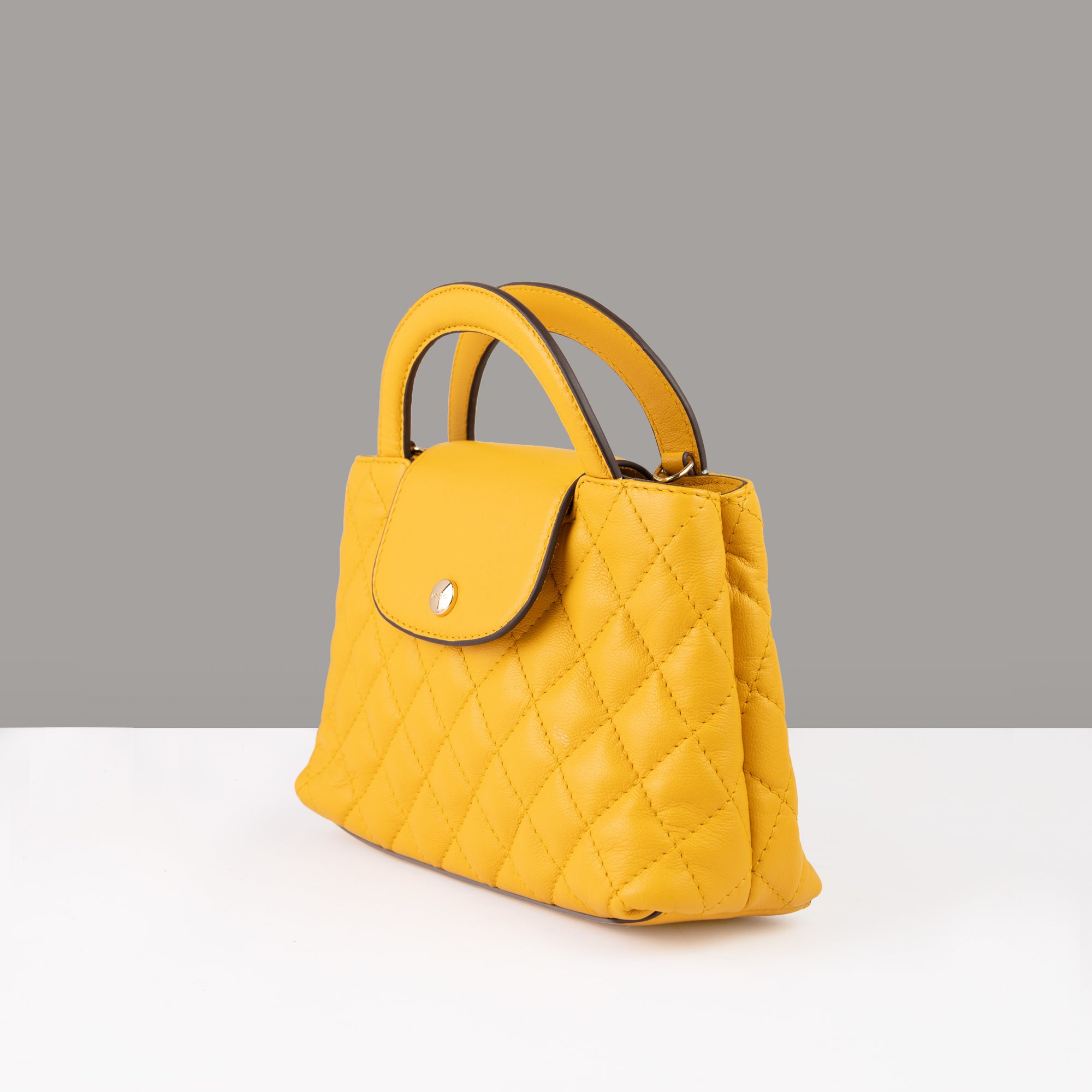 Lodis Mini Quilted Satchel in Curry – Three-Quarter View Showing Bag Structure and Flap Closure Detail | Lodis 1965
