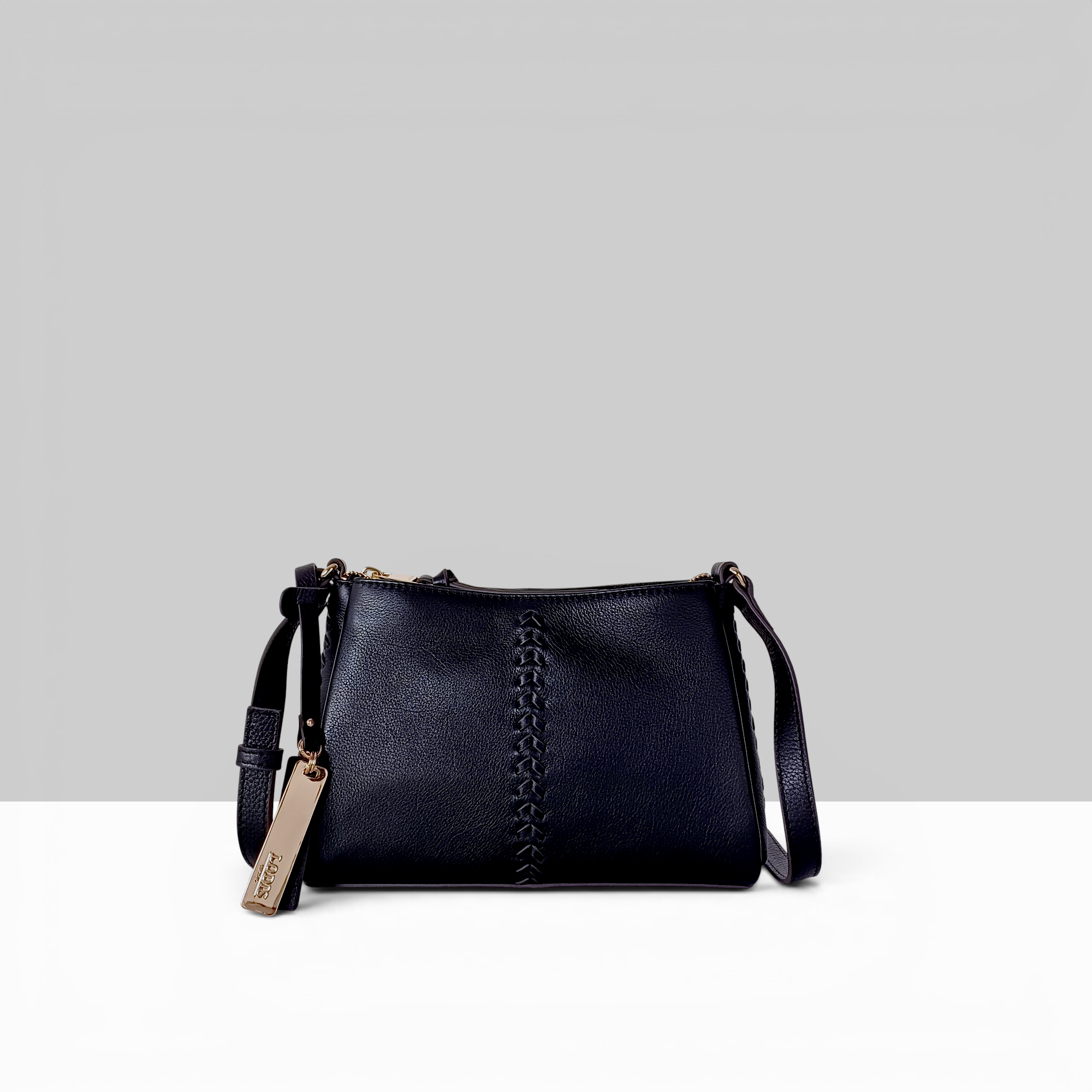 Lodis Nicks Crossbody in Black - Front View, Genuine Suede Leather with Whipstitch Detail and Gold-Tone Logo Tag | Lodis 1965