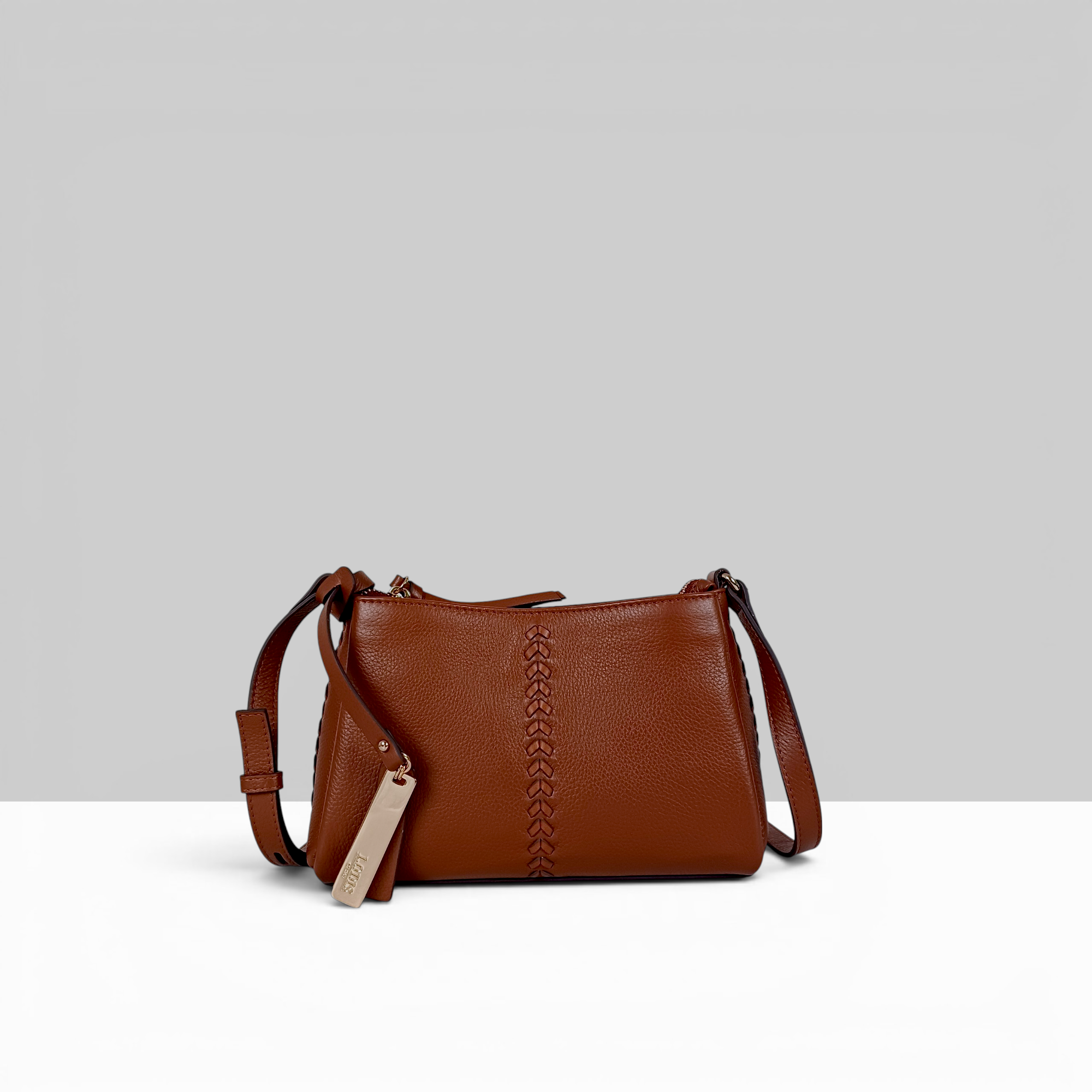 Lodis Nicks Crossbody in Chestnut - Front View, Genuine Suede Leather with Whipstitch Detail and Gold-Tone Logo Tag | Lodis 1965