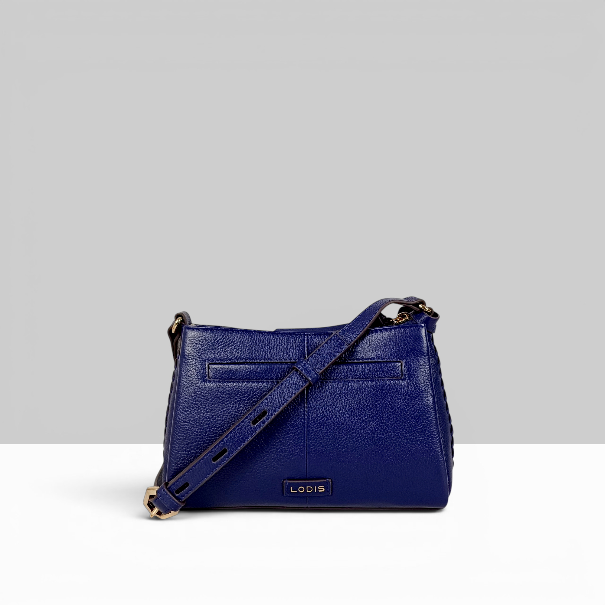 Lodis Nicks Crossbody in Evening Blue - Back View Showing Exterior Slip Pocket, Lodis Logo Plate and Adjustable Strap | Lodis 1965
