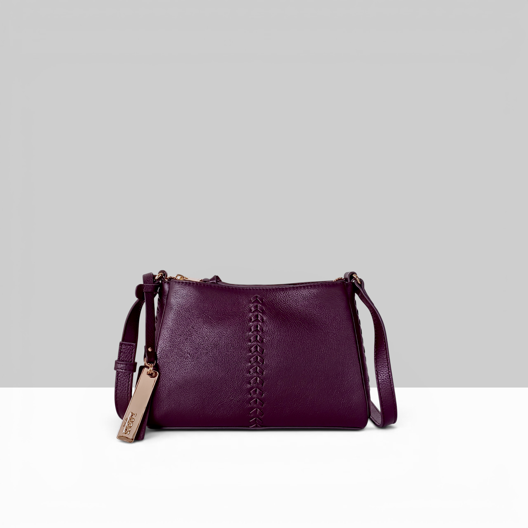 Lodis Nicks Crossbody in Wine - Front View, Genuine Suede Leather with Whipstitch Detail and Gold-Tone Logo Tag | Lodis 1965