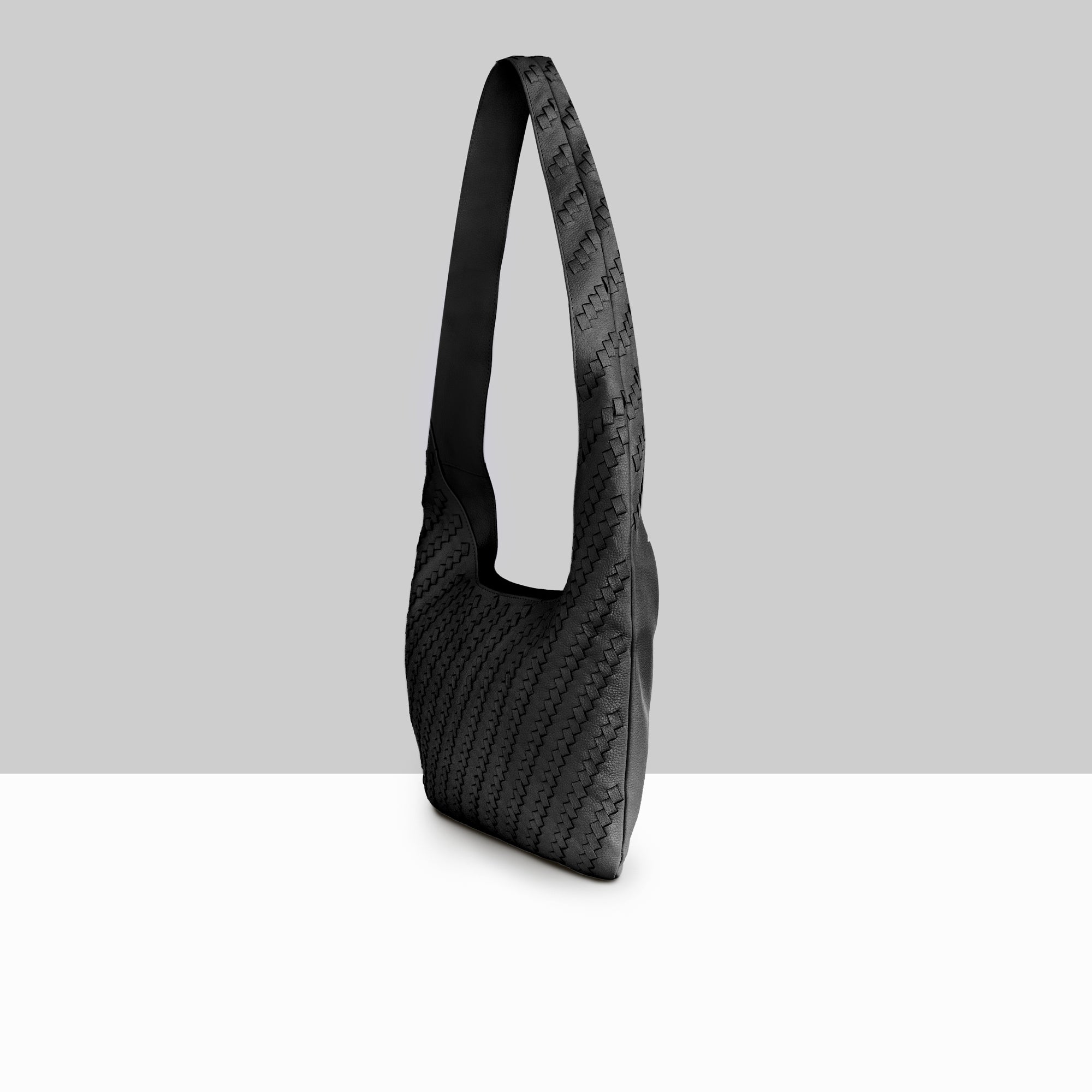 Lodis Solstice Hobo in Black – Side Profile View, Full Woven Pebbled Leather Texture and Single Shoulder Strap | Lodis 1965